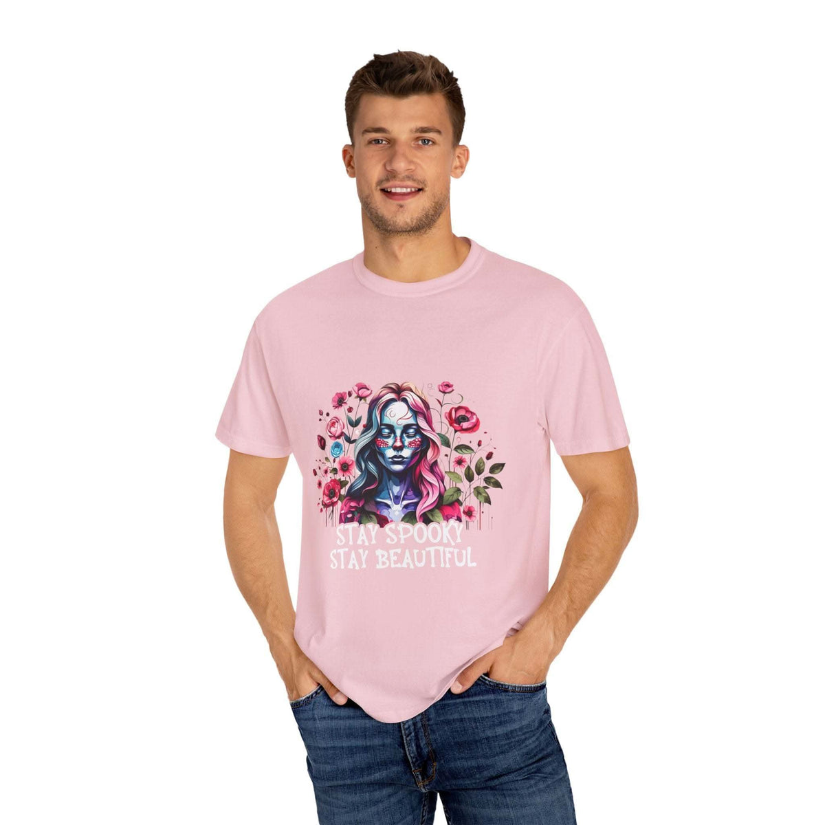 Man wearing pink floral skeleton t-shirt with "Stay Spooky Stay Beautiful" text and relaxed fit