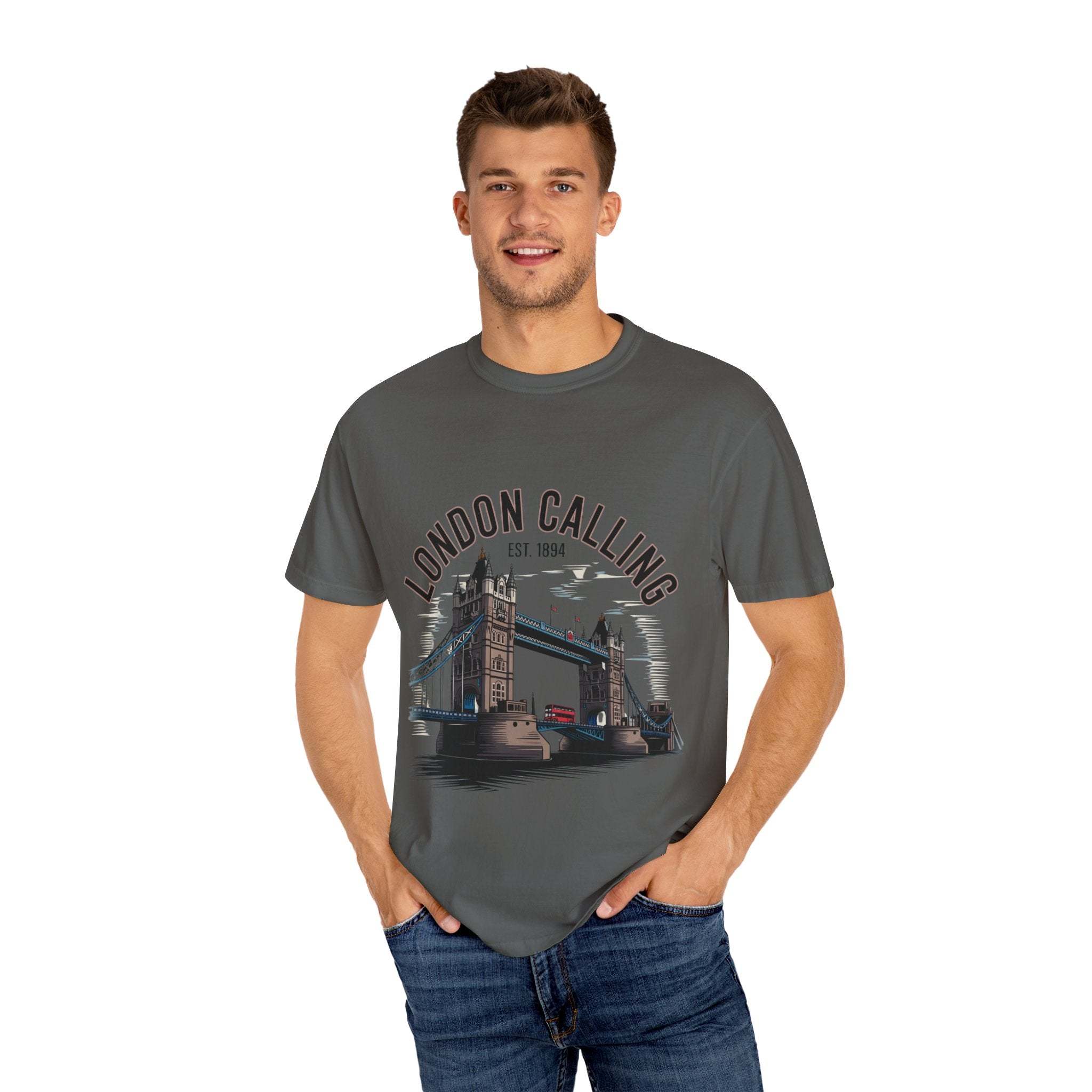 Man wearing London Calling Travel T-shirt with Tower Bridge graphic on dark grey garment-dyed fabric