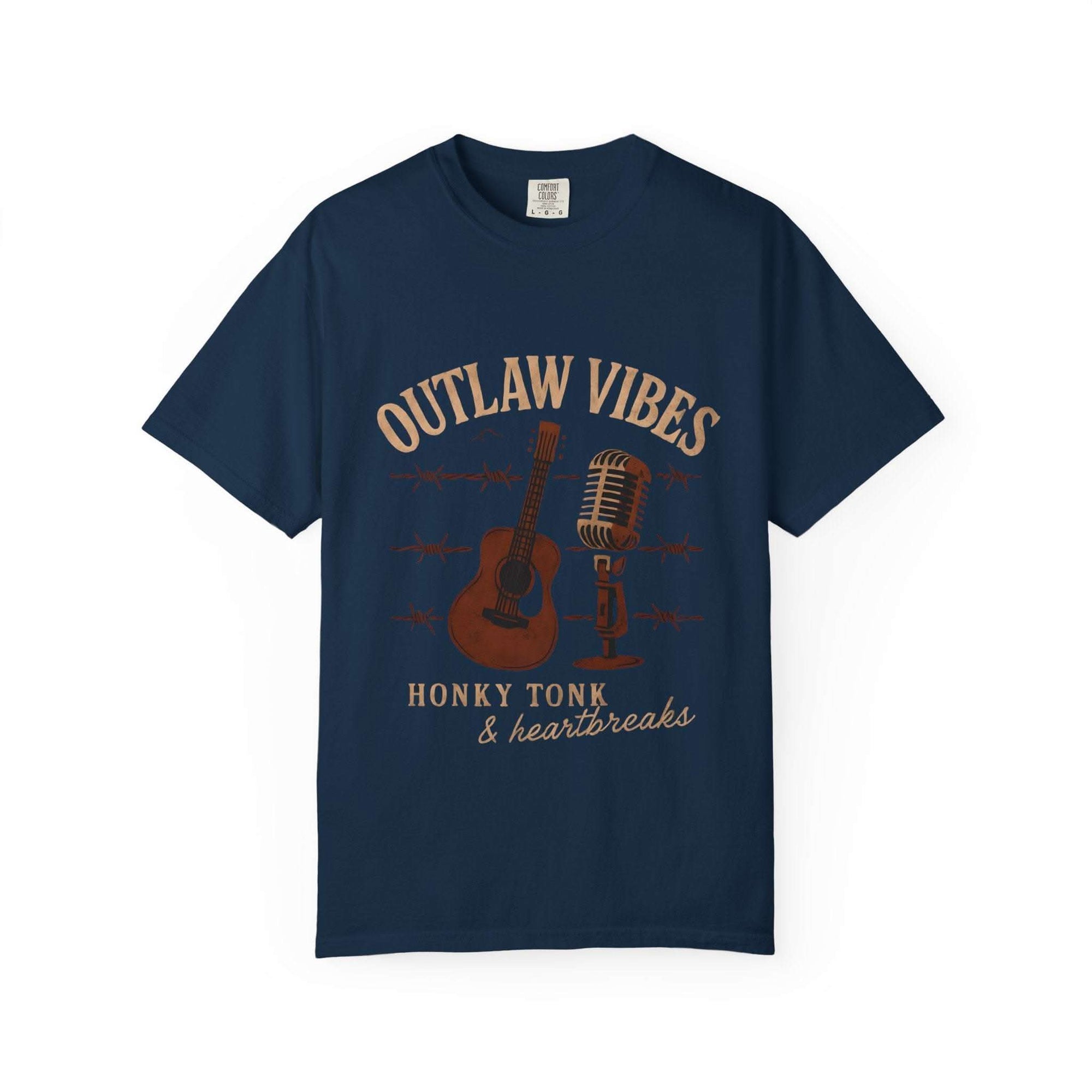 Navy blue t-shirt with 'Outlaw Vibes' graphic design featuring a guitar and microphone on a white background.