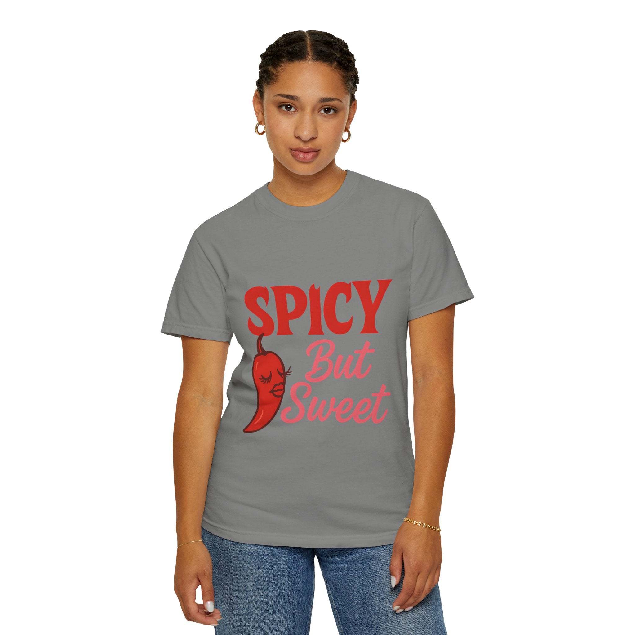 Woman wearing grey garment-dyed unisex spicy but sweet t-shirt with red chili pepper graphic and text