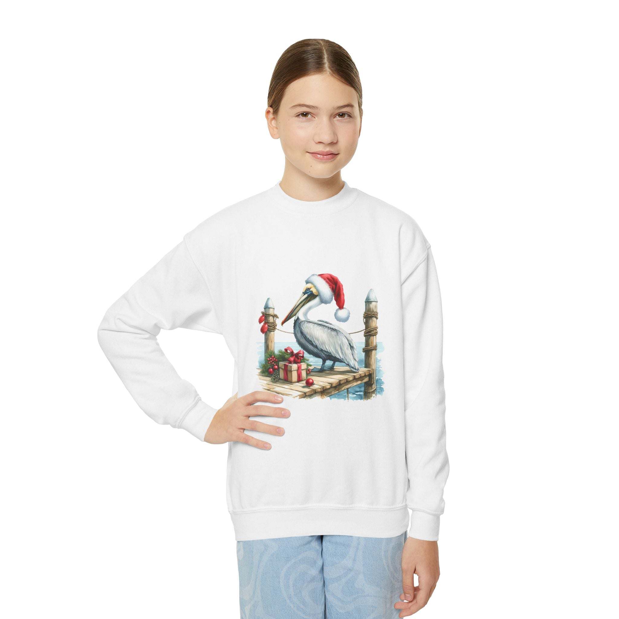 Youth wearing white Pelican Santa Hat crewneck sweatshirt with pelican in Santa hat embroidery and coastal holiday design