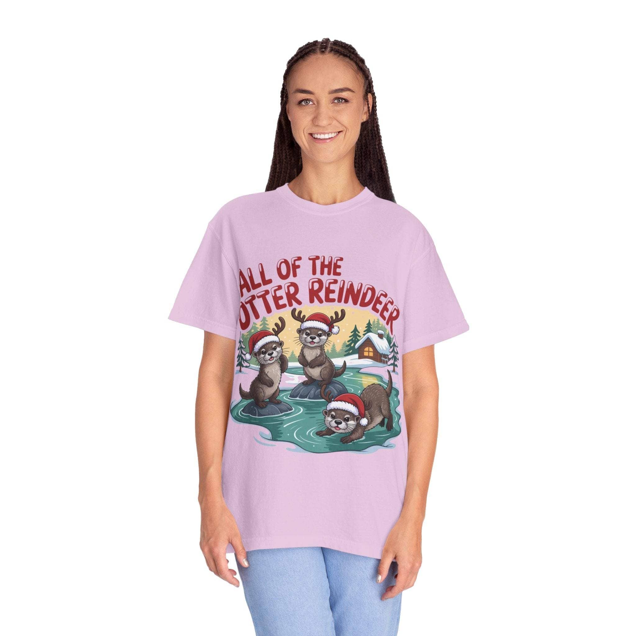 Woman wearing a pink Otter Reindeer Tee with festive otter reindeer design and holiday theme