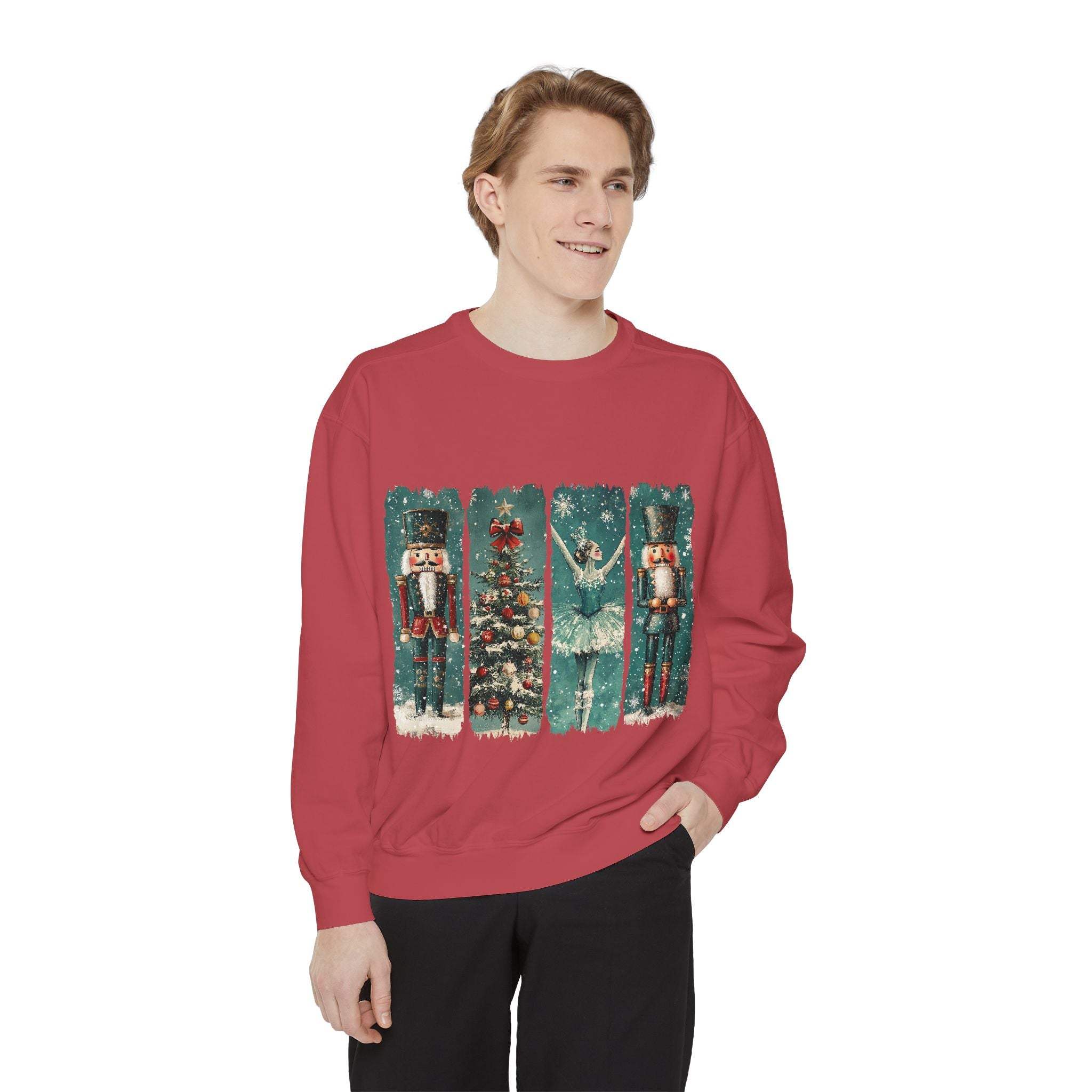 Vintage Christmas Nutcracker red sweatshirt with holiday-themed nutcracker, ballerina, and Christmas tree design worn by a smiling man