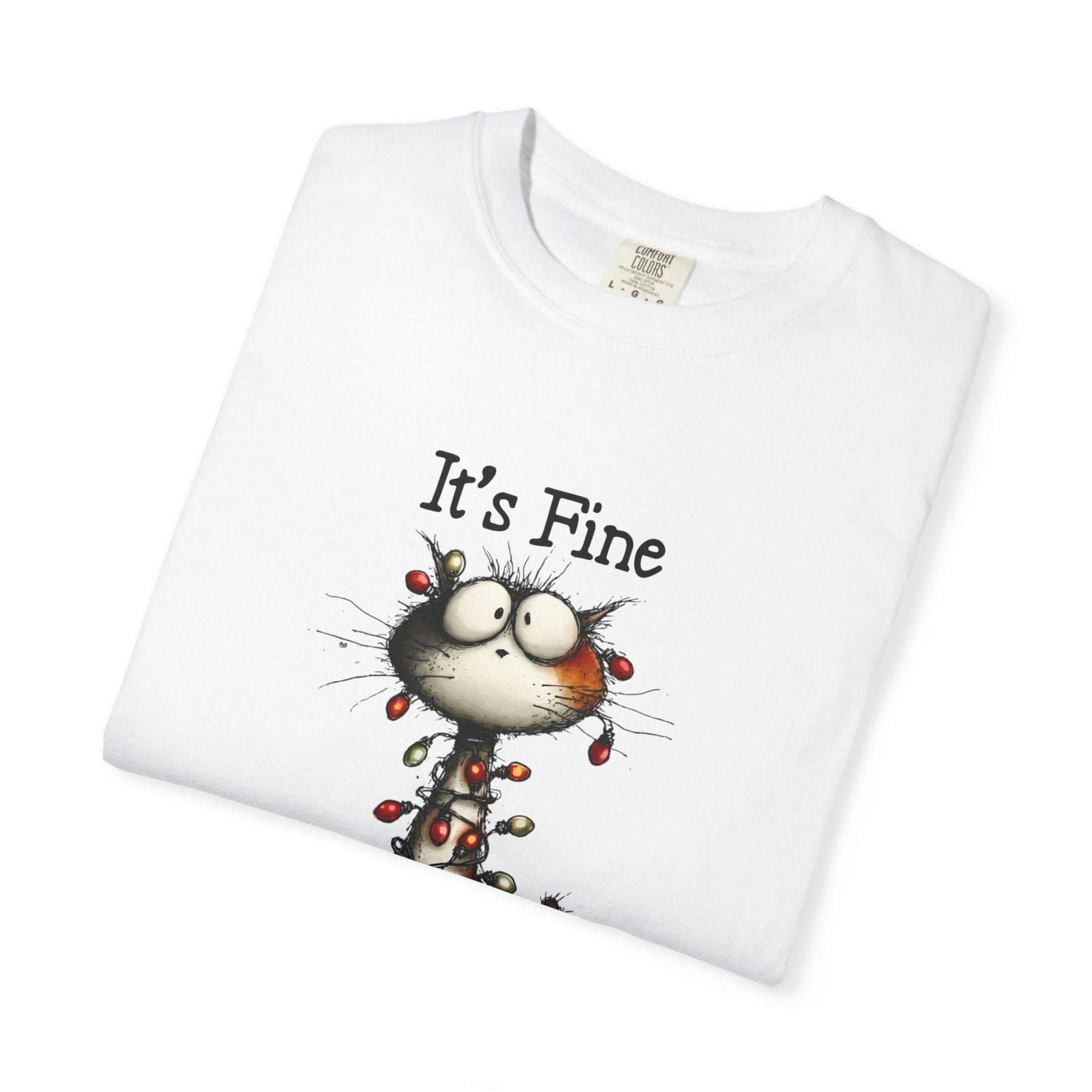 White t-shirt with a cartoon cat and 'It's Fine' text on a white background