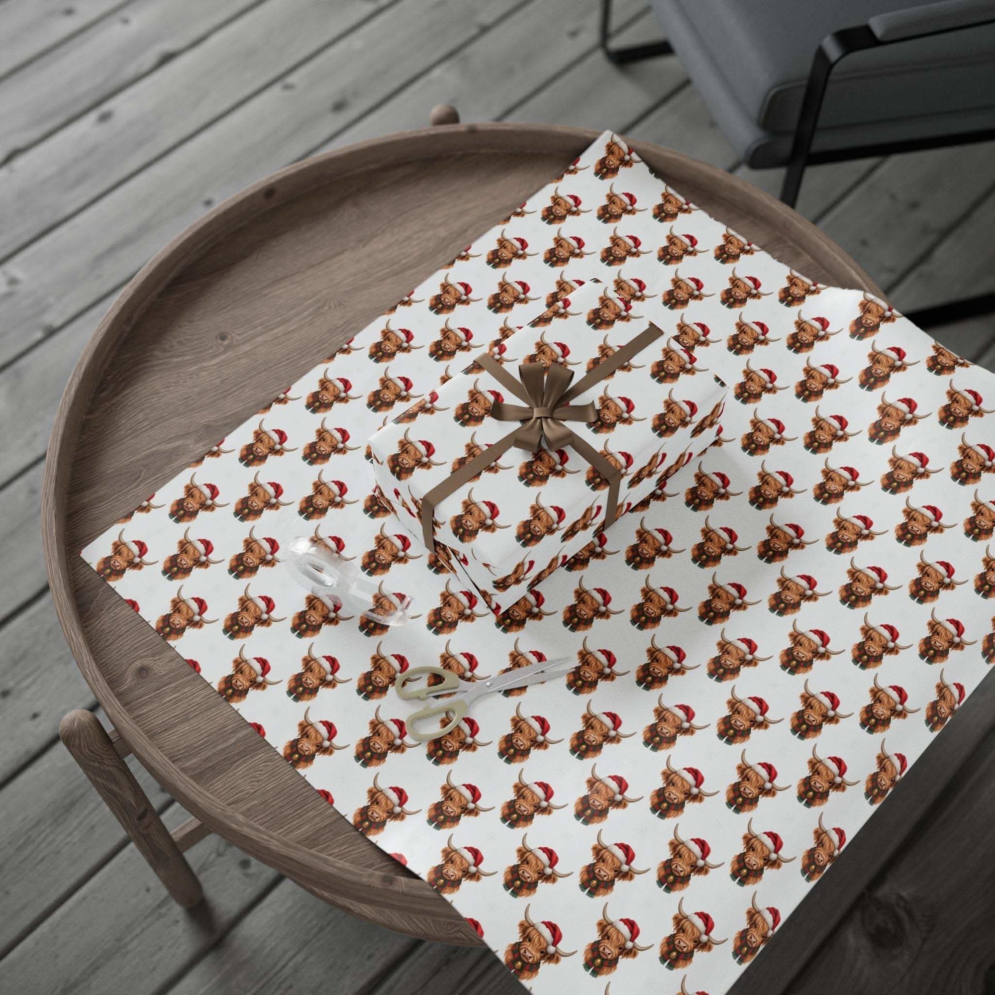 Gift wrapping paper with Santa Highland Cows design on white background, perfect for Christmas gifts