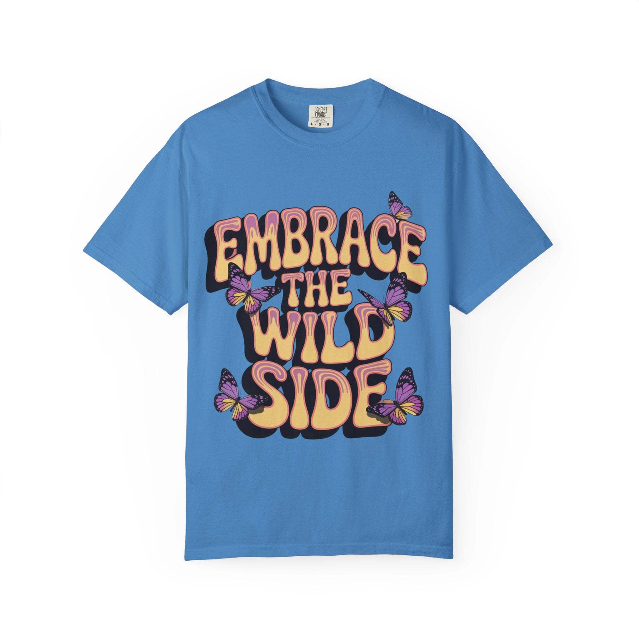 Blue garment-dyed T-shirt with "Embrace the Wild Side" text and butterfly print, unisex, soft cotton fabric