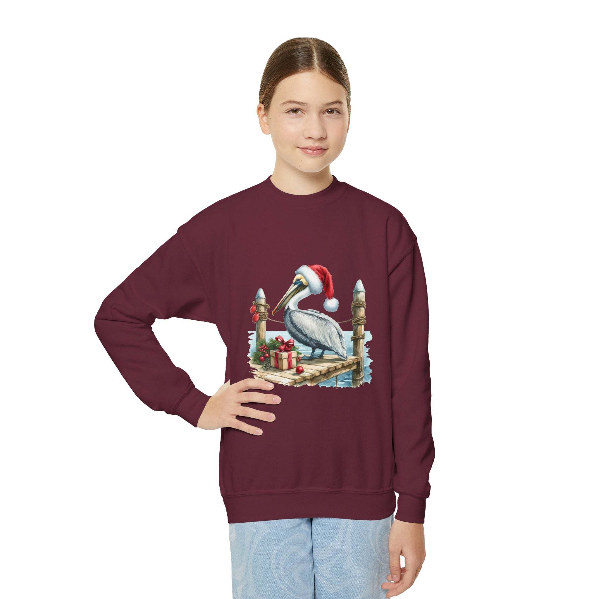 Youth crewneck sweatshirt with a pelican wearing a Santa hat embroidered on front in festive holiday design