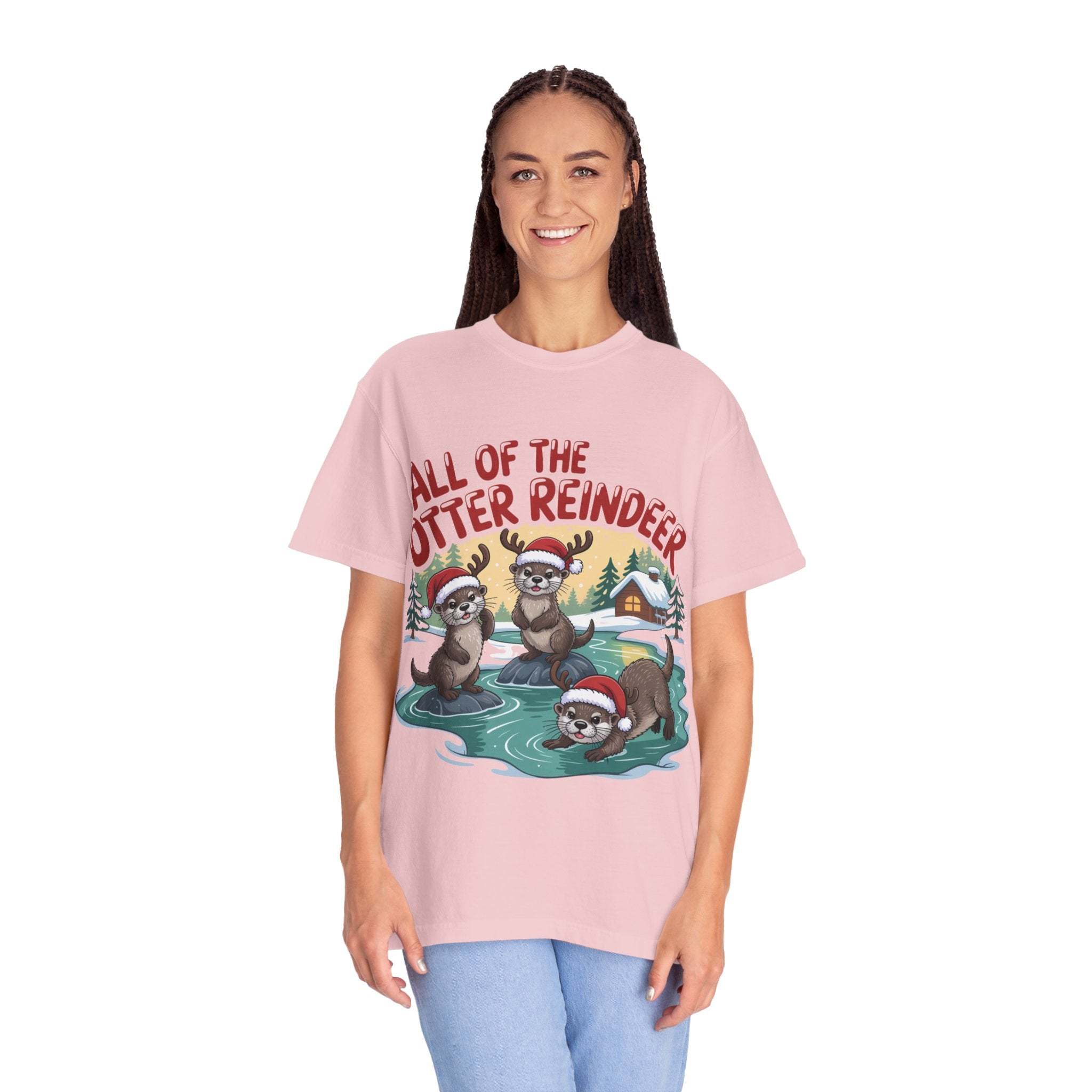 Woman wearing a pink Otter Reindeer Tee with festive otter reindeer design and holiday theme