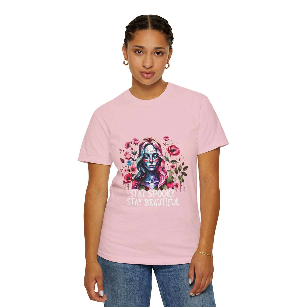Woman wearing pink floral skeleton t-shirt with "Stay Spooky Stay Beautiful" text and relaxed fit