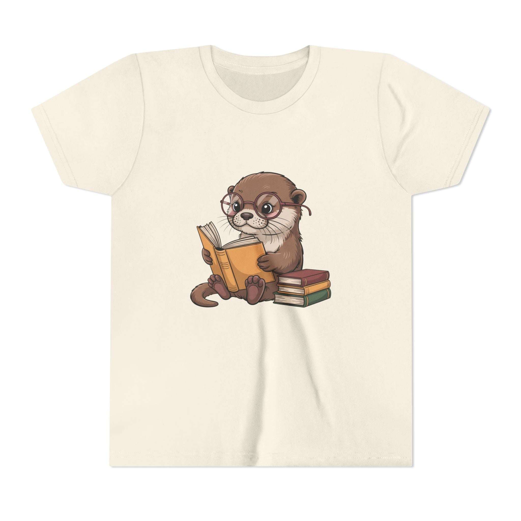 Beige t-shirt with an otter reading a book graphic on a white background
