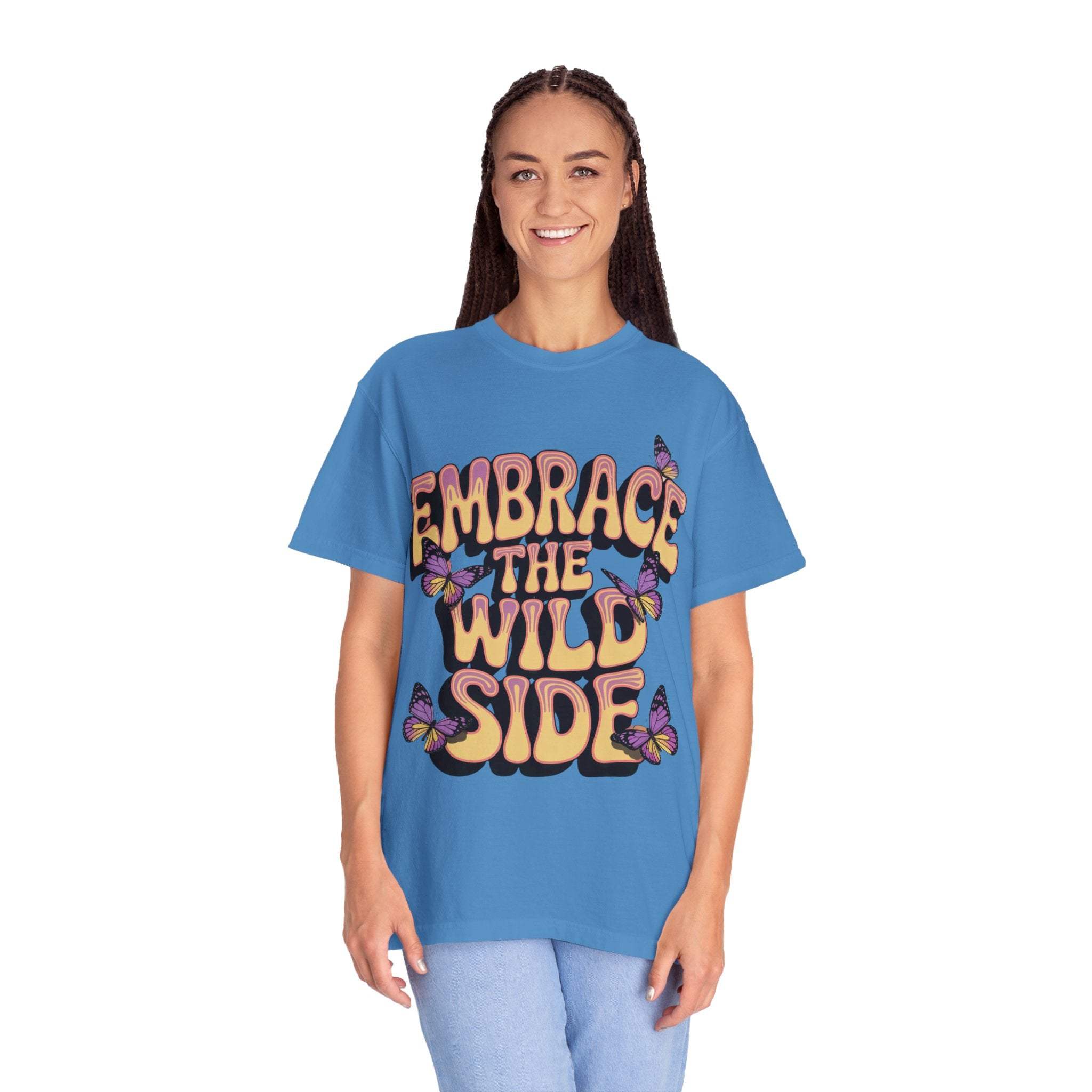 Unisex garment-dyed T-shirt in blue with "Embrace the Wild Side" print and butterfly design