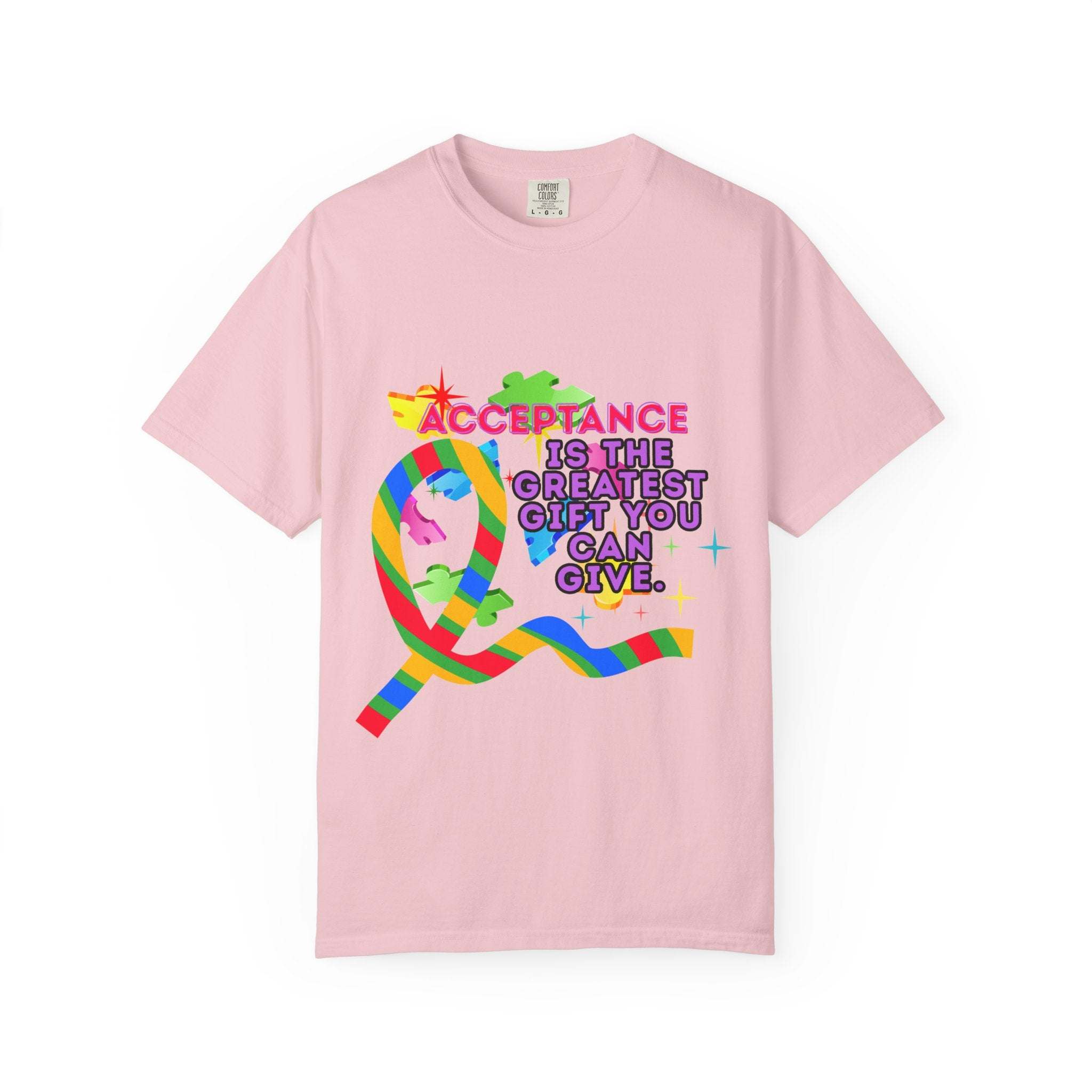 Garment-dyed pink T-shirt with colorful autism acceptance ribbon and message promoting inclusivity and support