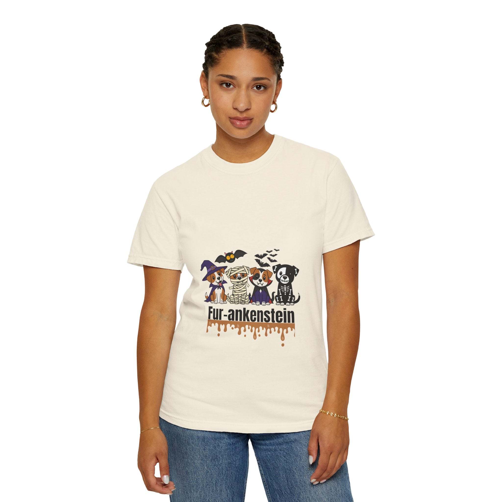 Woman wearing a puppies Halloween T-shirt with puppies in costumes and "Fur-ankenstein" text on cream cotton fabric
