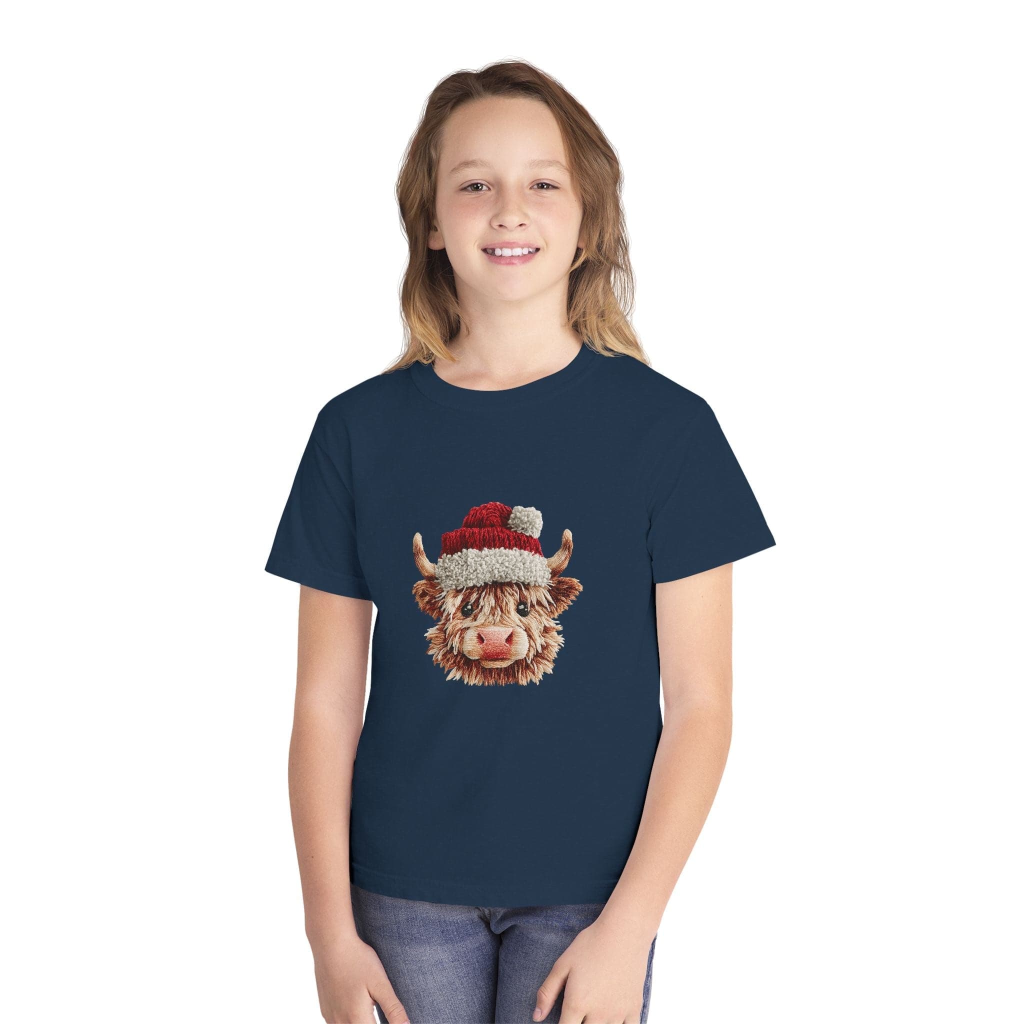 Youth wearing navy Santa Highland Cow Youth Tee with faux crochet yarn Highland cow in Santa hat design