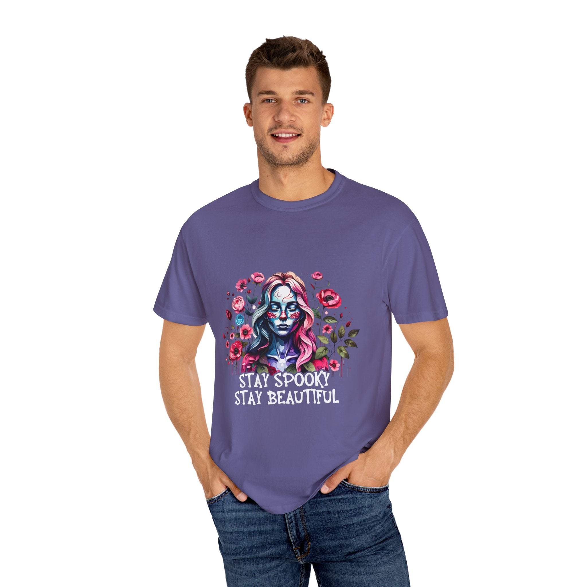 Man wearing purple floral skeleton t-shirt with "Stay Spooky Stay Beautiful" text and floral design