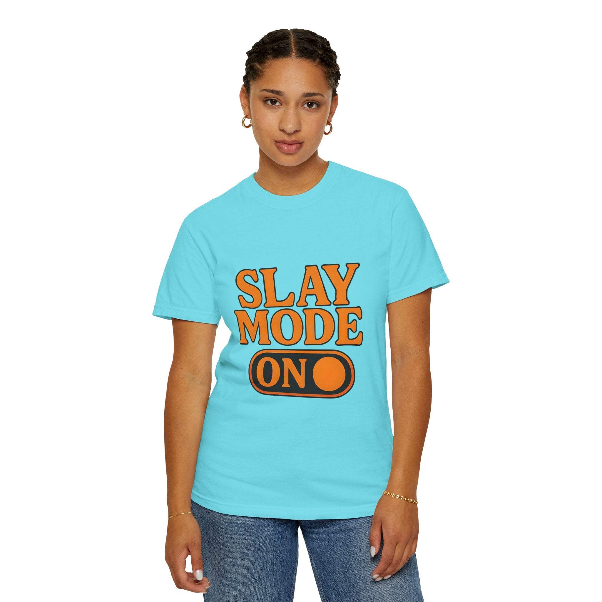 Woman wearing blue garment-dyed tee with "Slay Mode On" orange text printed on front