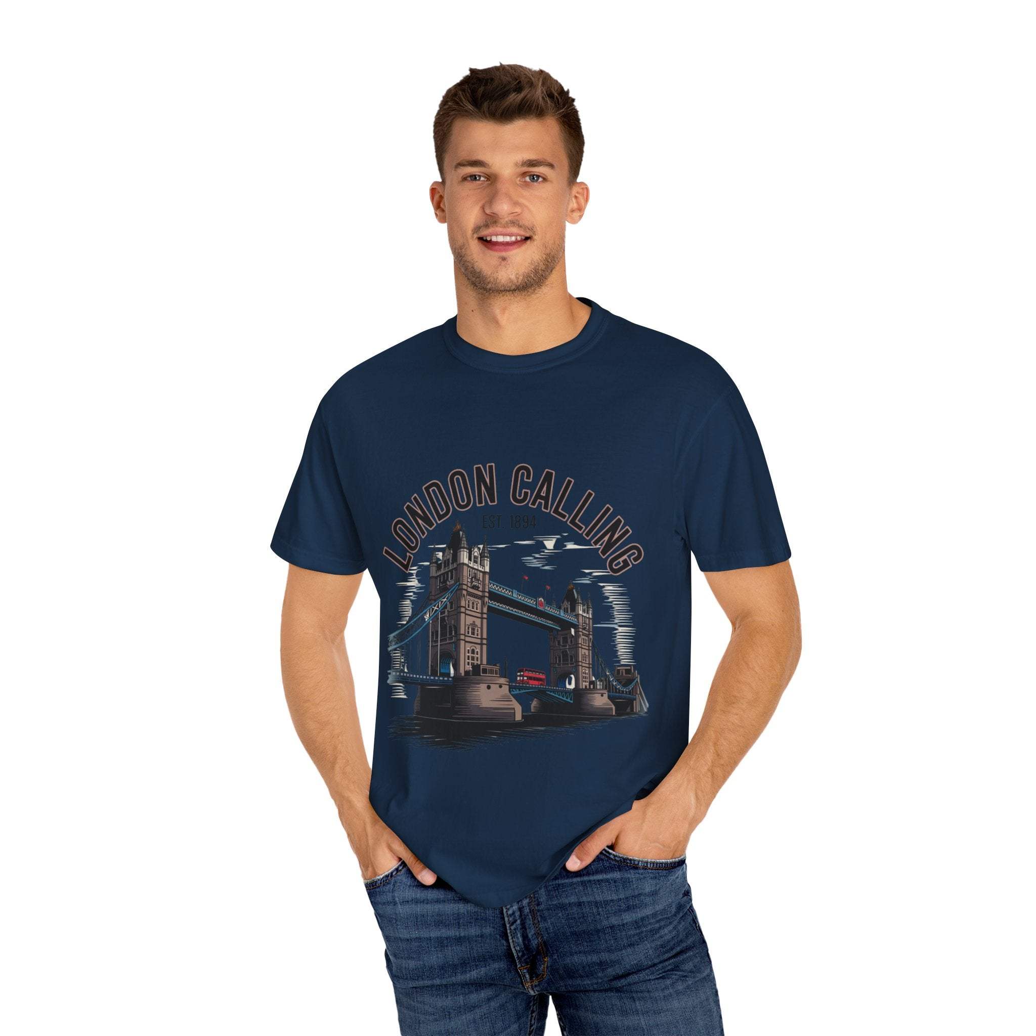 Man wearing navy London Calling Travel T-shirt with Tower Bridge graphic and text