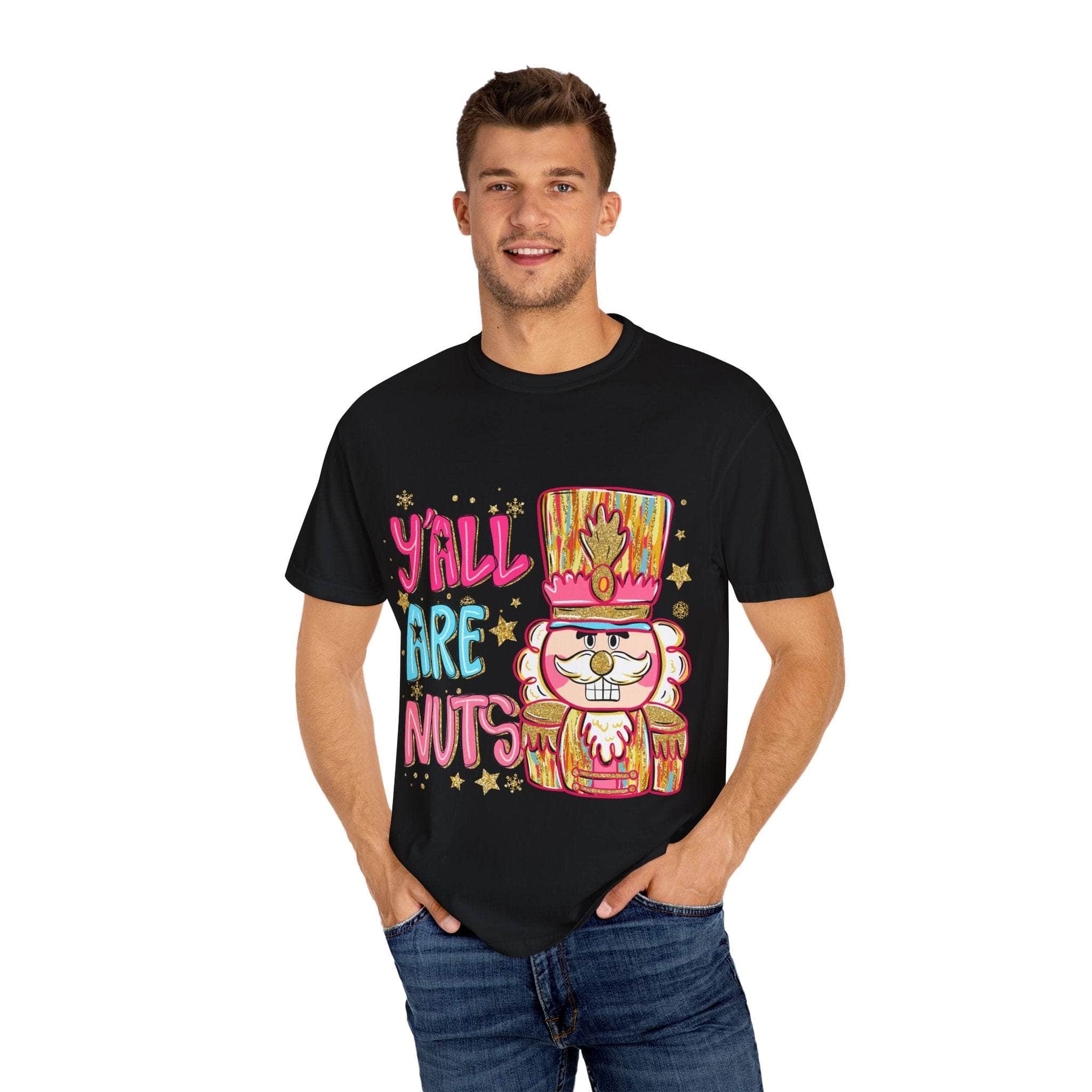 Man wearing black Yall Are Nuts Nutcracker T-shirt with colorful cartoon nutcracker design and festive text