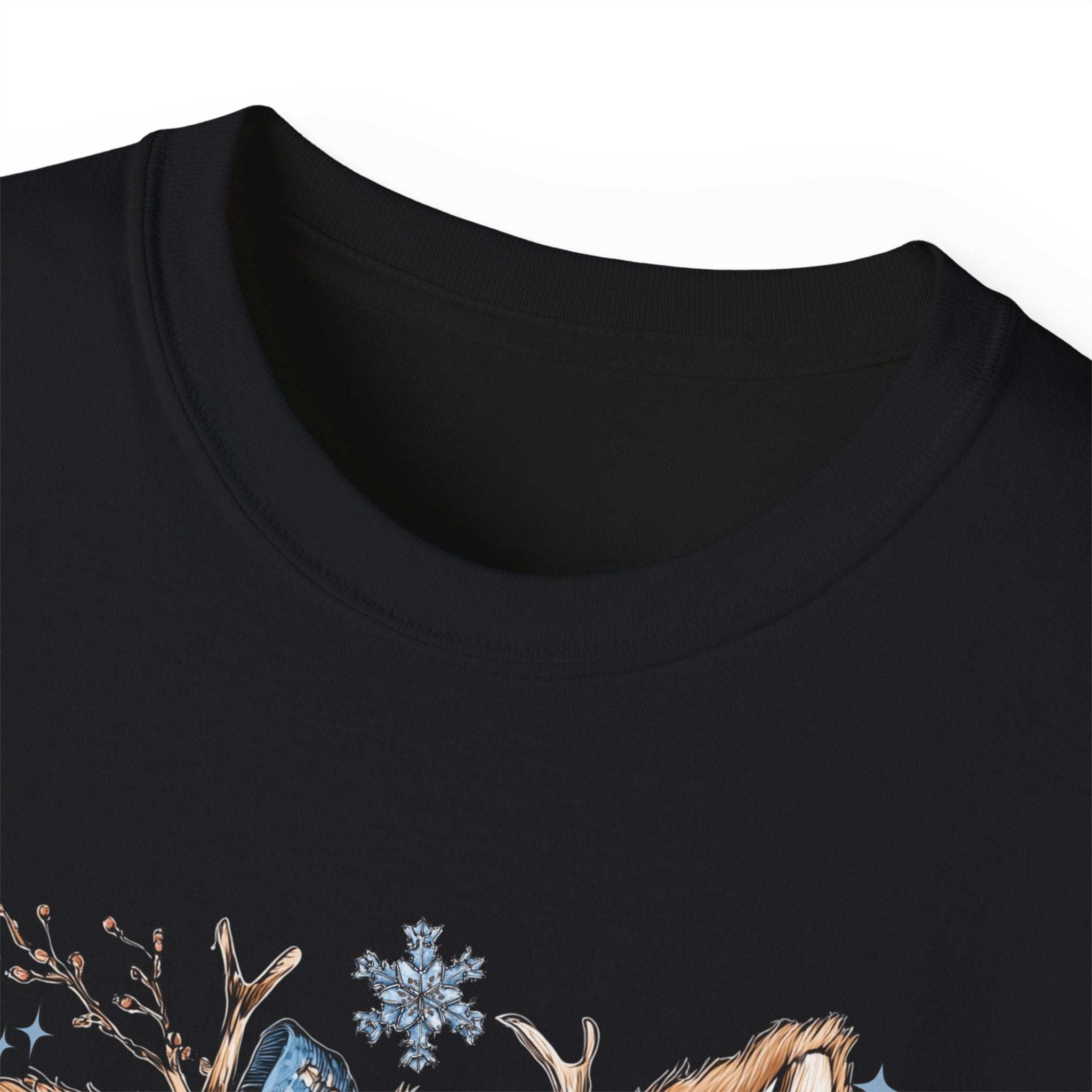 White t-shirt with retro patchwork reindeer design wearing blue scarf and surrounded by snowflakes