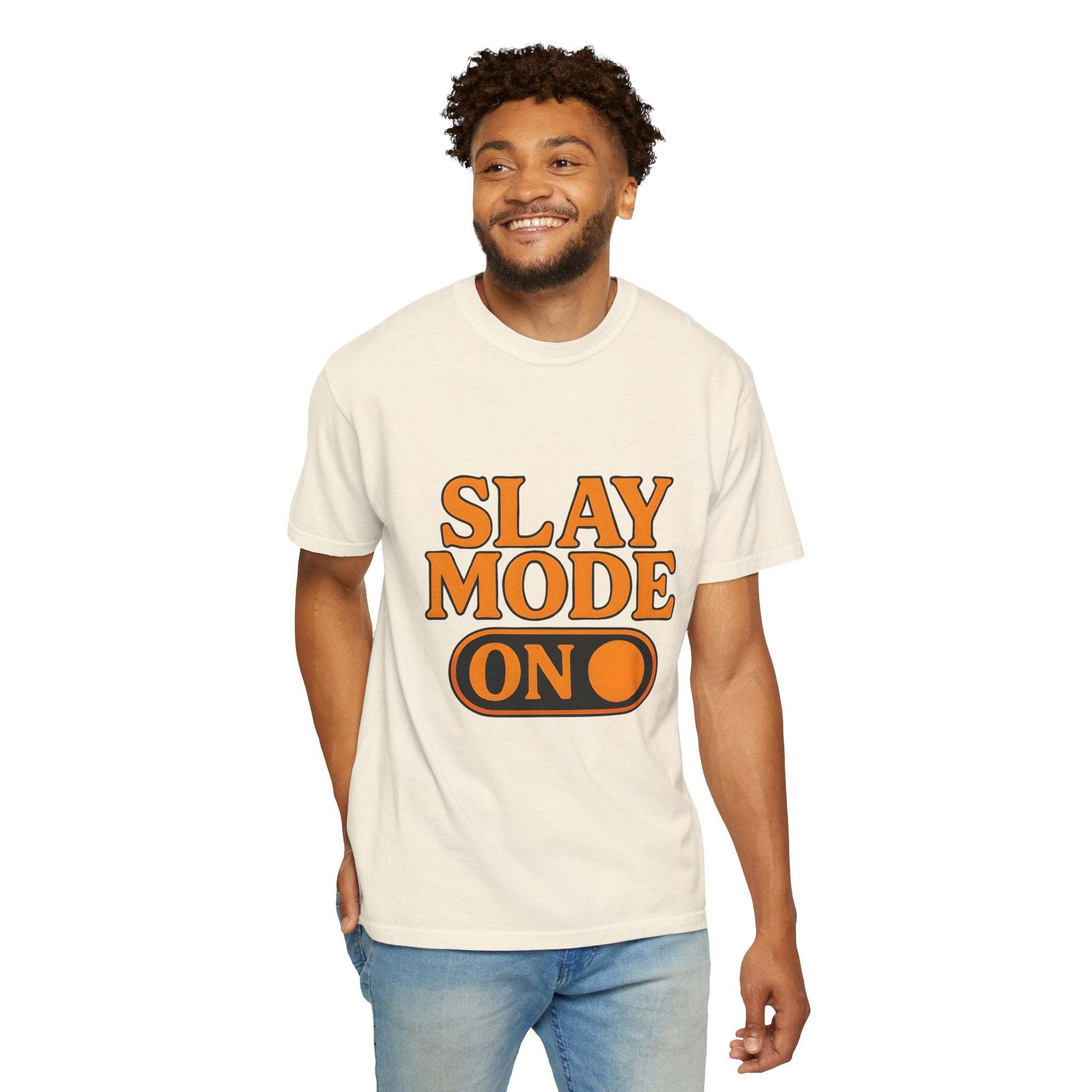 Man wearing cream Garment-Dyed Tee with "Slay Mode On" text in orange and black