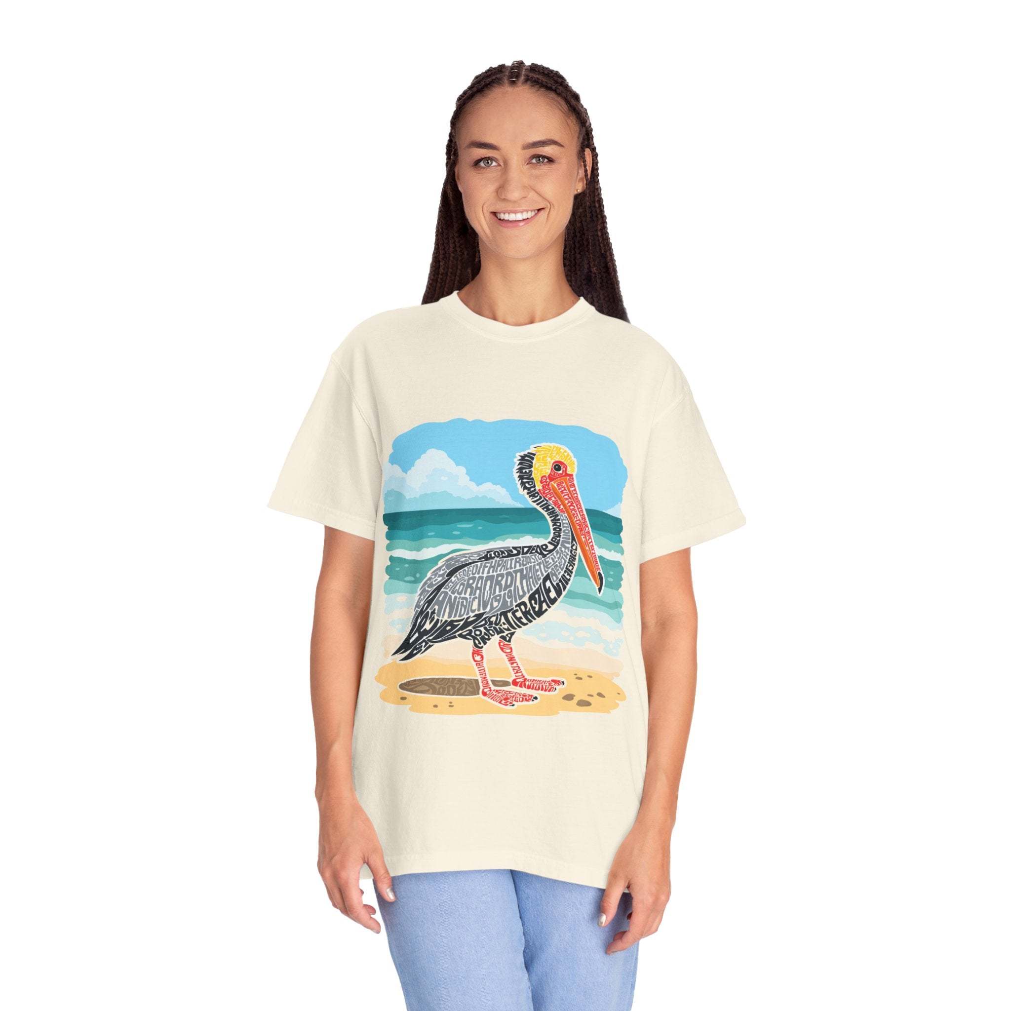 Woman wearing vintage coastal graphic tee with pelican letter poster design at the beach