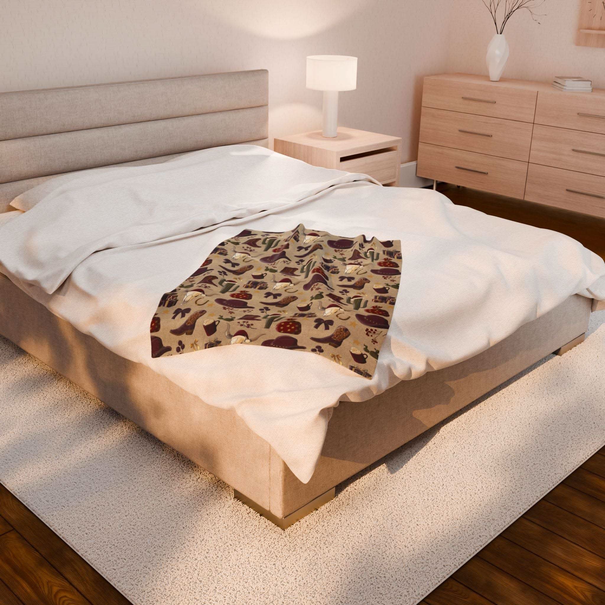 Cozy plush blanket with cowboy Christmas design on bed in modern bedroom