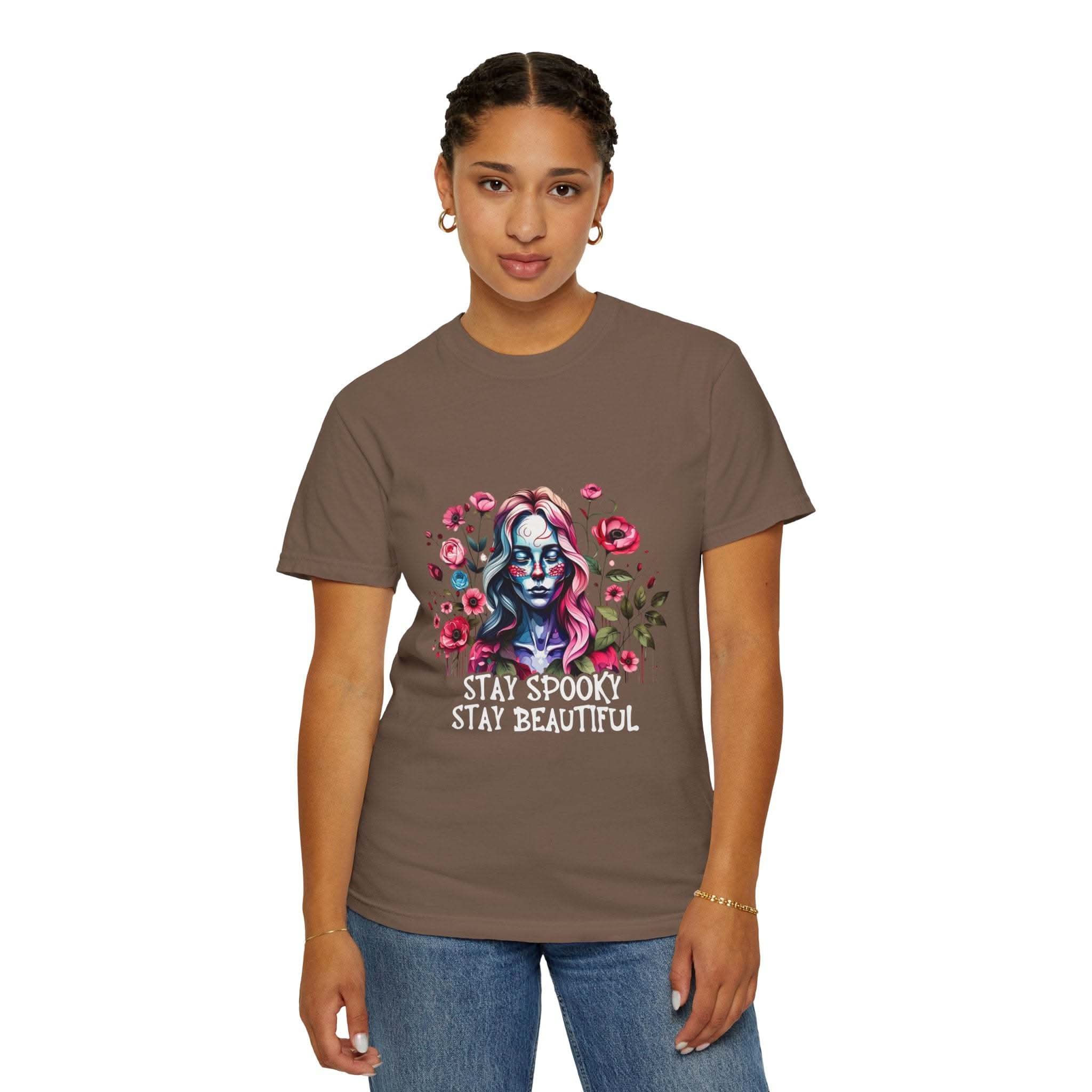 Woman wearing soft everyday tee with elegant floral skeleton print and "Stay Spooky Stay Beautiful" text, relaxed fit floral skeleton t-shirt