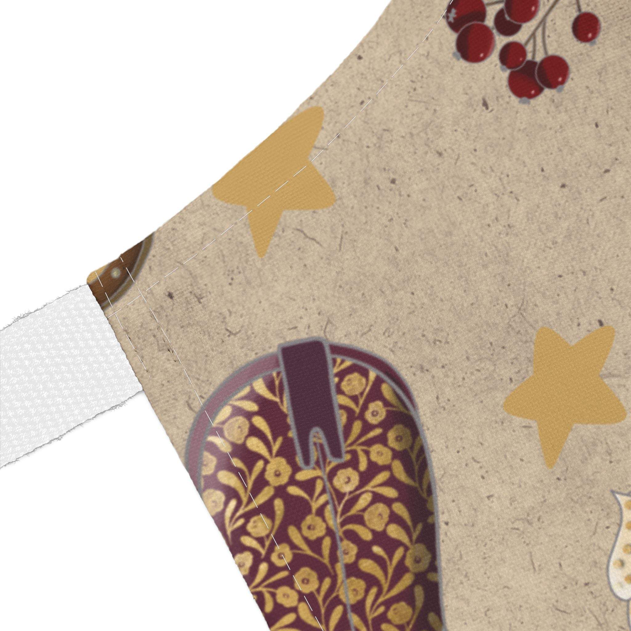 Cowboy Christmas apron with festive star and boot design on beige fabric, stain-resistant and comfortable for holiday cooking.