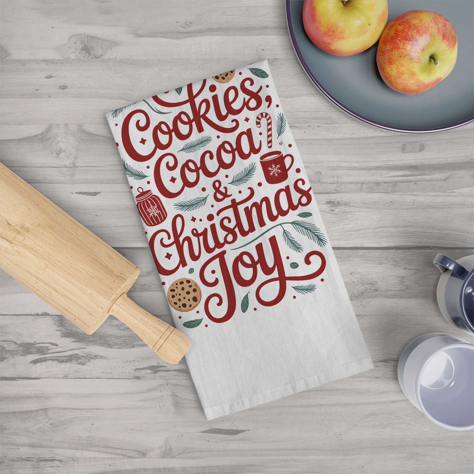 Holiday-themed tea towel with cookies, cocoa, and Christmas design in a kitchen setting