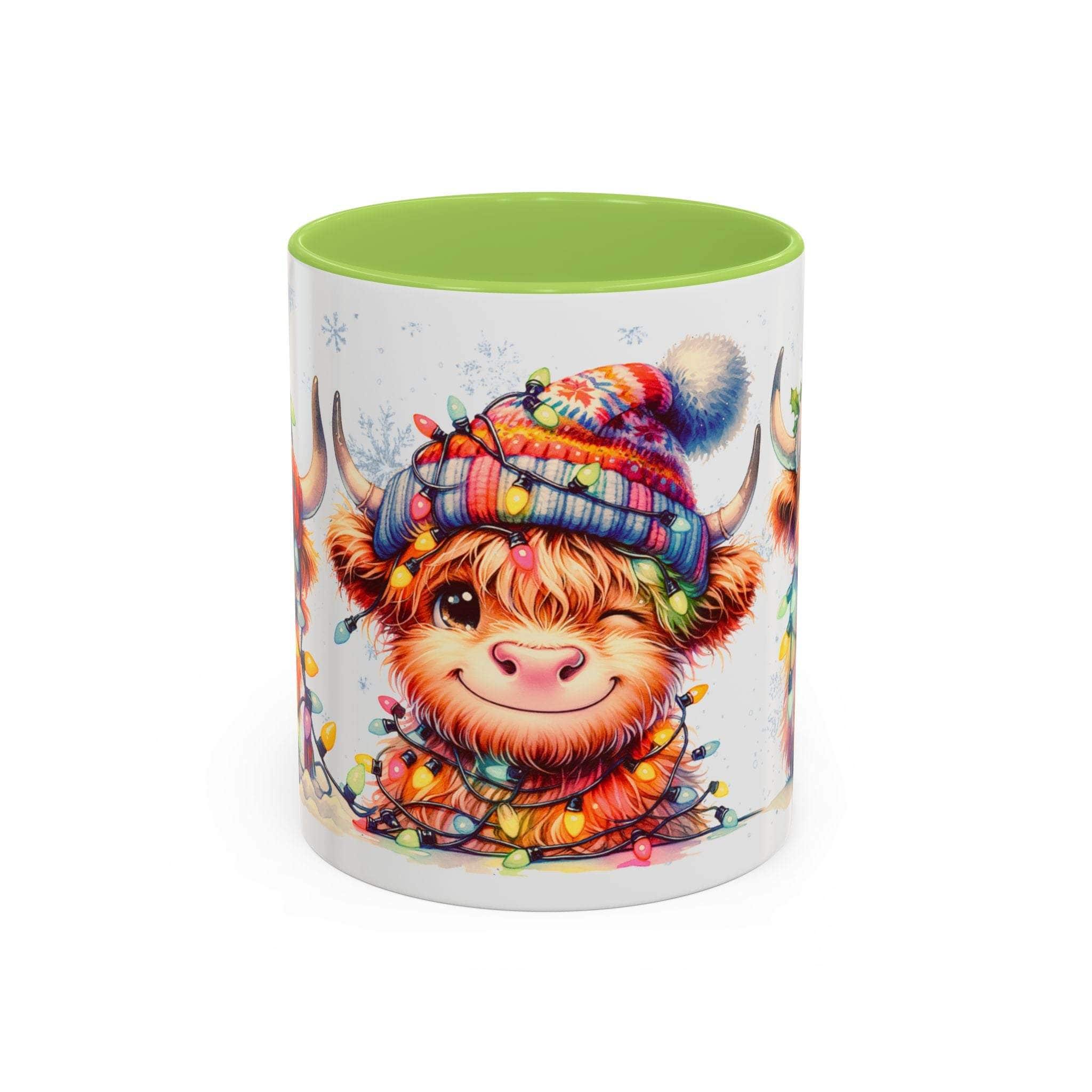 Mug with a cartoon Highland cow wearing a colorful hat and surrounded by lights on a white background