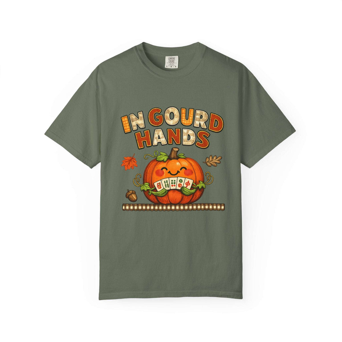 An olive green short-sleeve t-shirt with a festive Halloween graphic on the front. The graphic features the text 'IN GOURD HANDS' in orange and yellow, above a smiling orange pumpkin with a 'OH EWA' sign for its eyes, set against a clean white background.