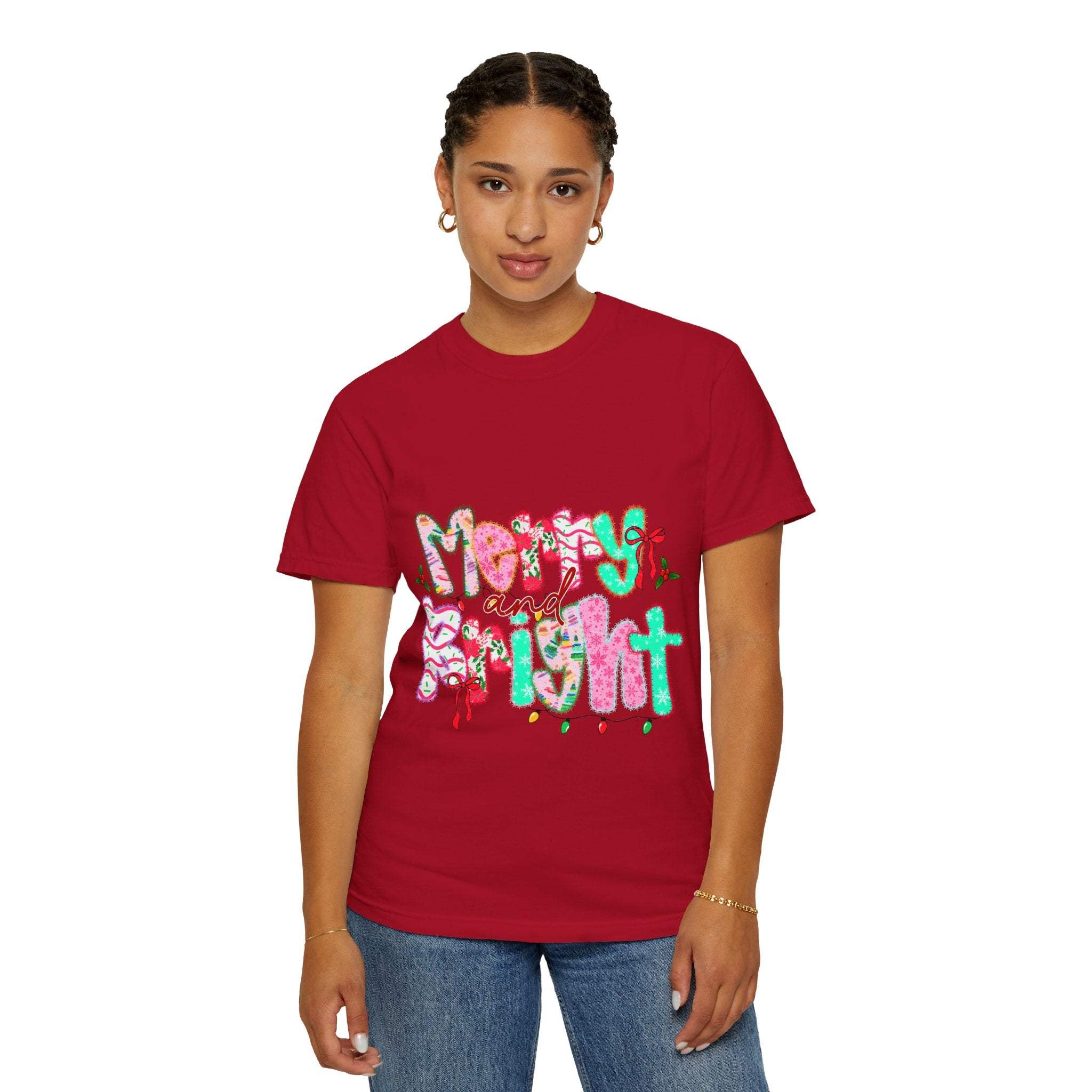 Woman wearing a red Merry and Bright T-shirt with festive holiday lettering and a relaxed fit