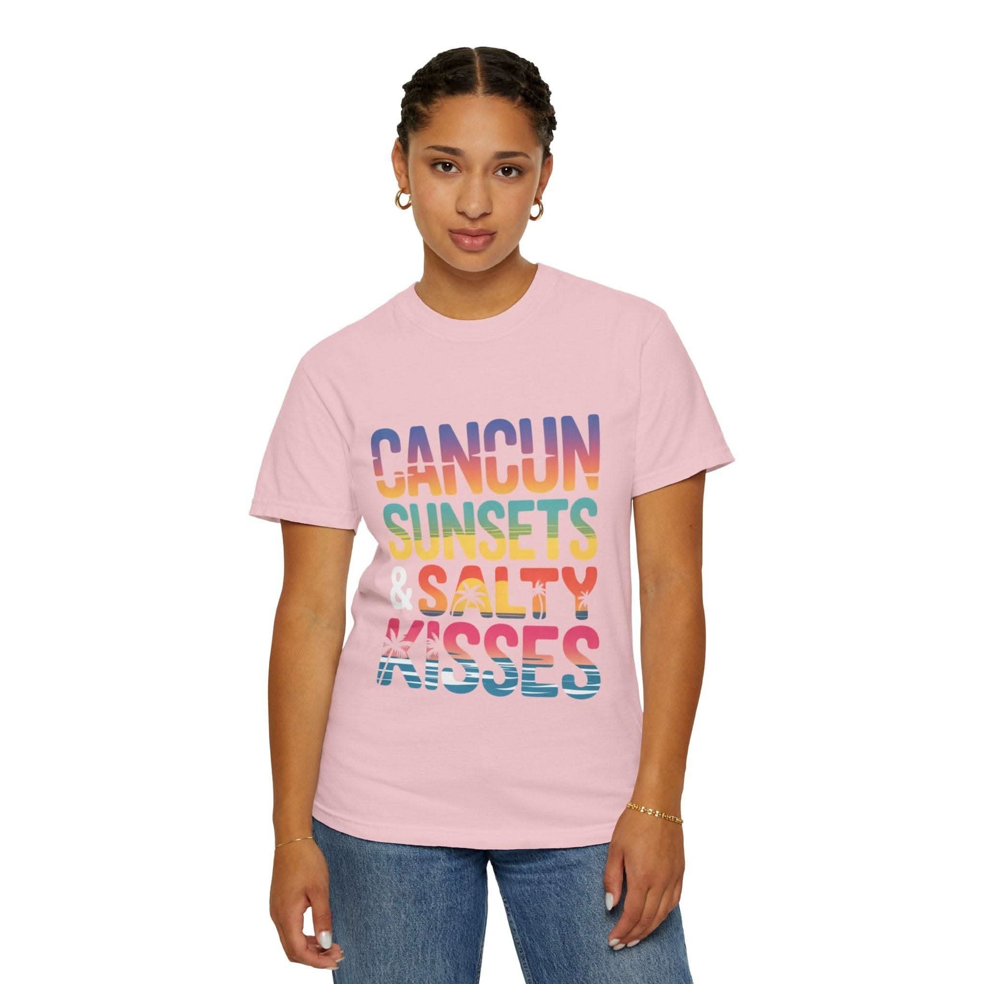 Person wearing a pink t-shirt with colorful text on a white background