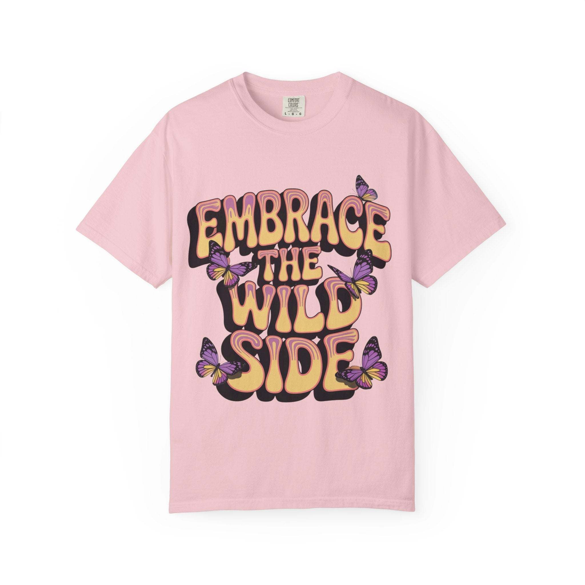 Pink garment-dyed T-shirt with "Embrace the Wild Side" print and butterfly design, unisex, soft cotton, casual wear