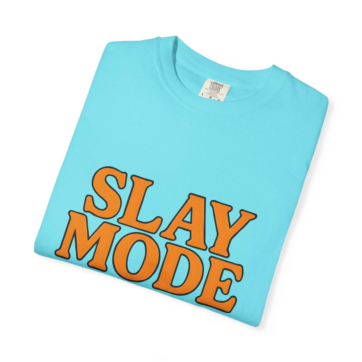 Light blue garment-dyed tee with bold orange "Slay Mode" text for confident casual wear