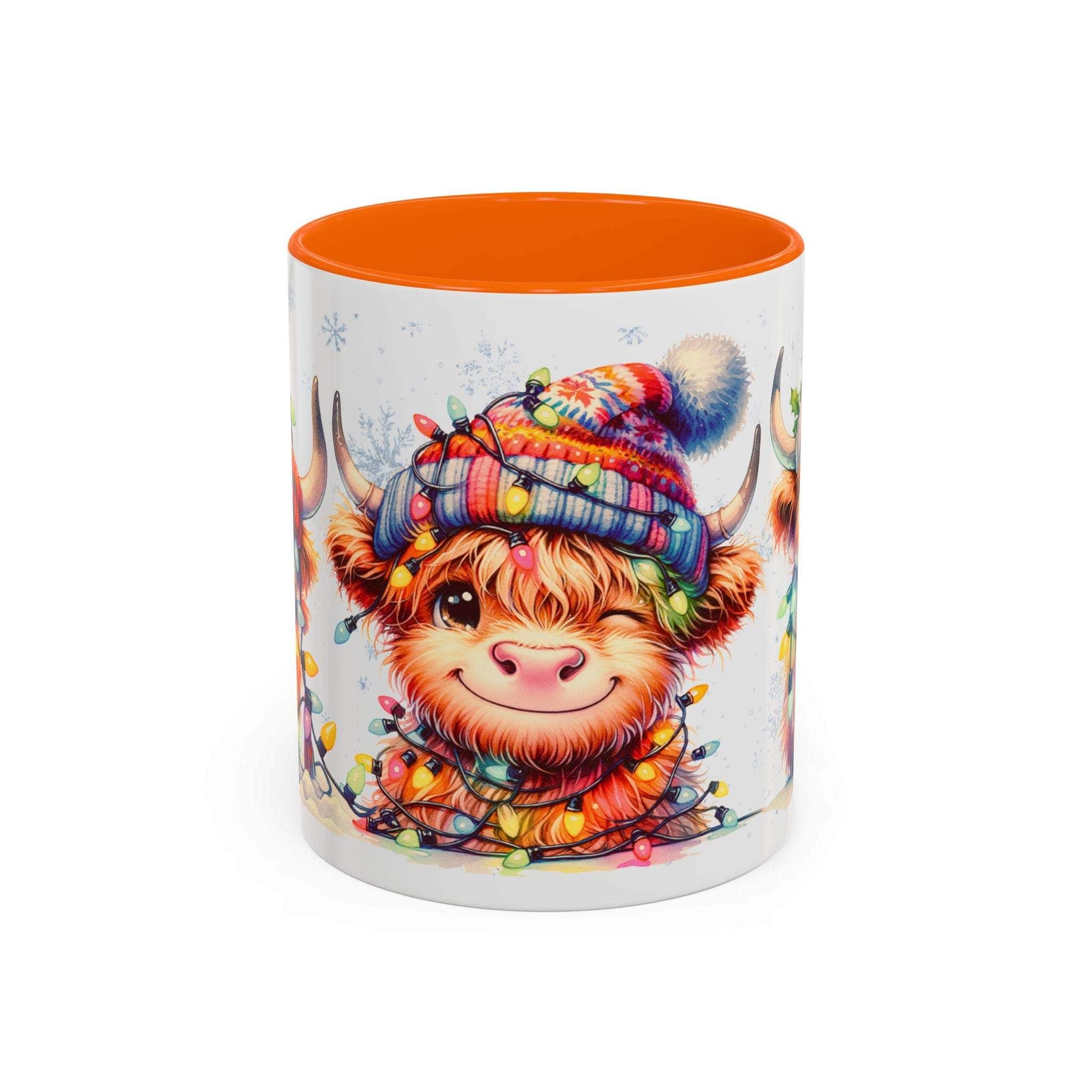 Mug with a cartoon Highland cow wearing a colorful hat and surrounded by lights on a white background