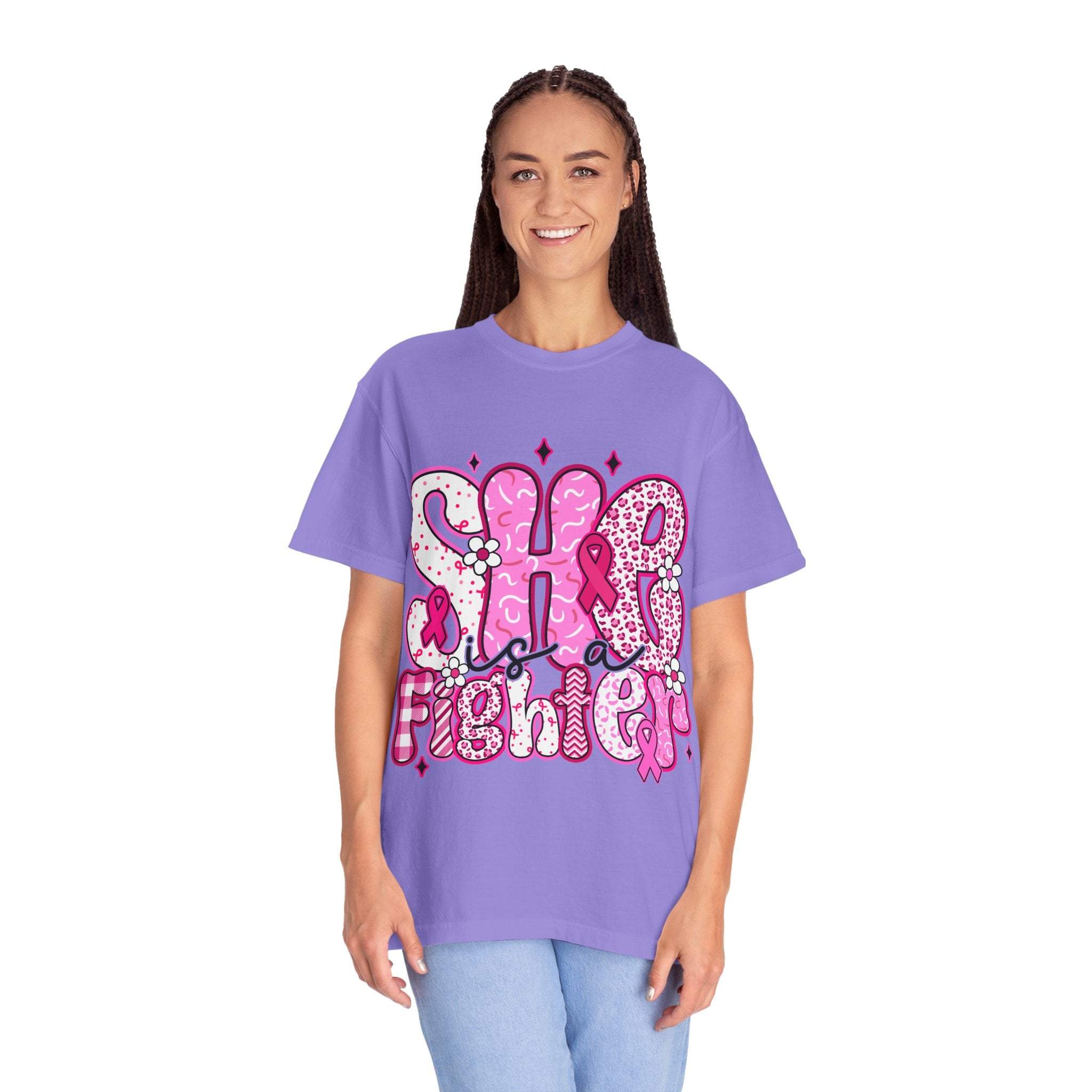 Woman wearing purple Fighter Breast Cancer T-shirt with pink ribbon design and supportive message