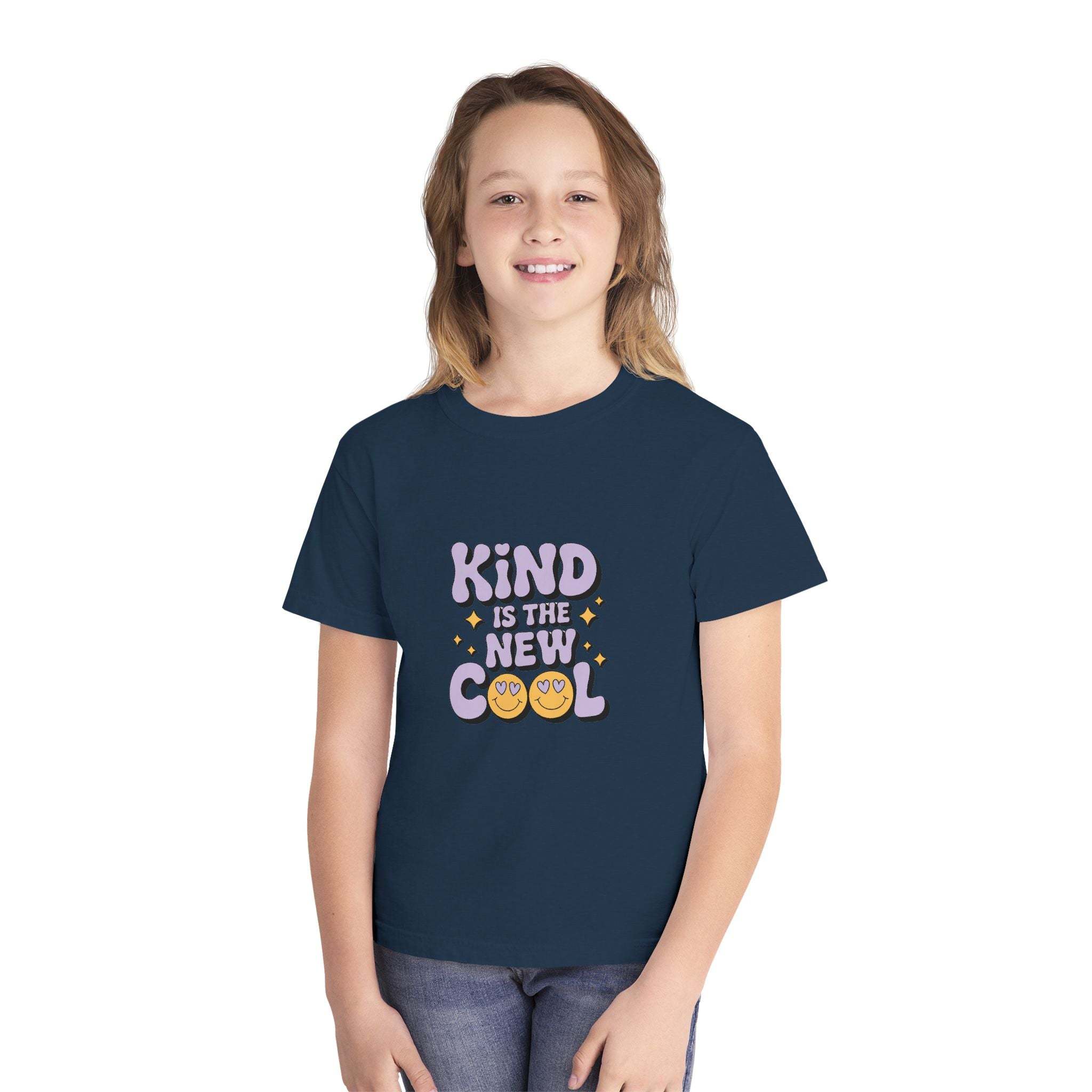 Youth wearing navy blue Youth Tee with "Kind is the new Cool" design promoting kindness and positivity