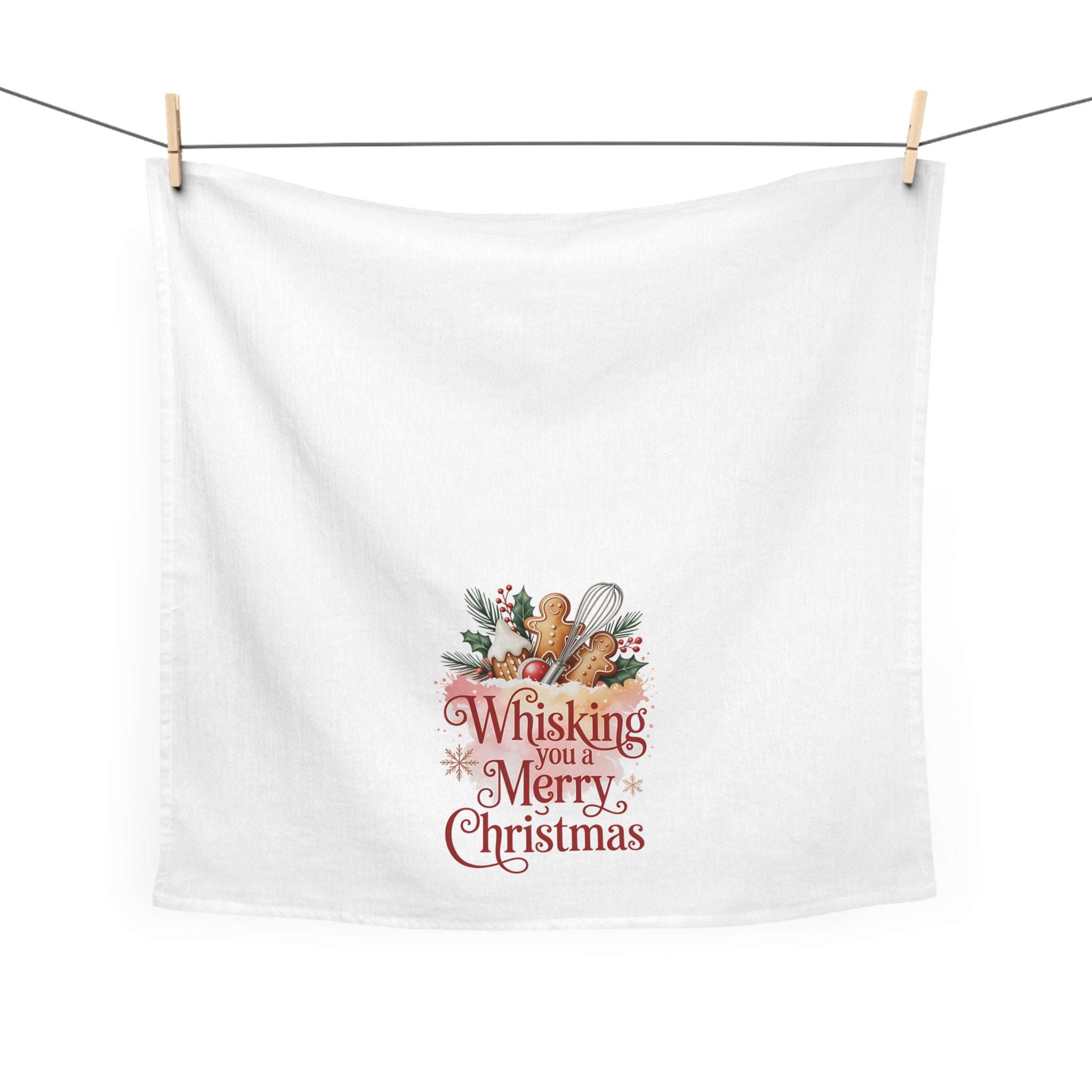 White Christmas tea towel with festive "Whisking you a Merry Christmas" design and holiday accents