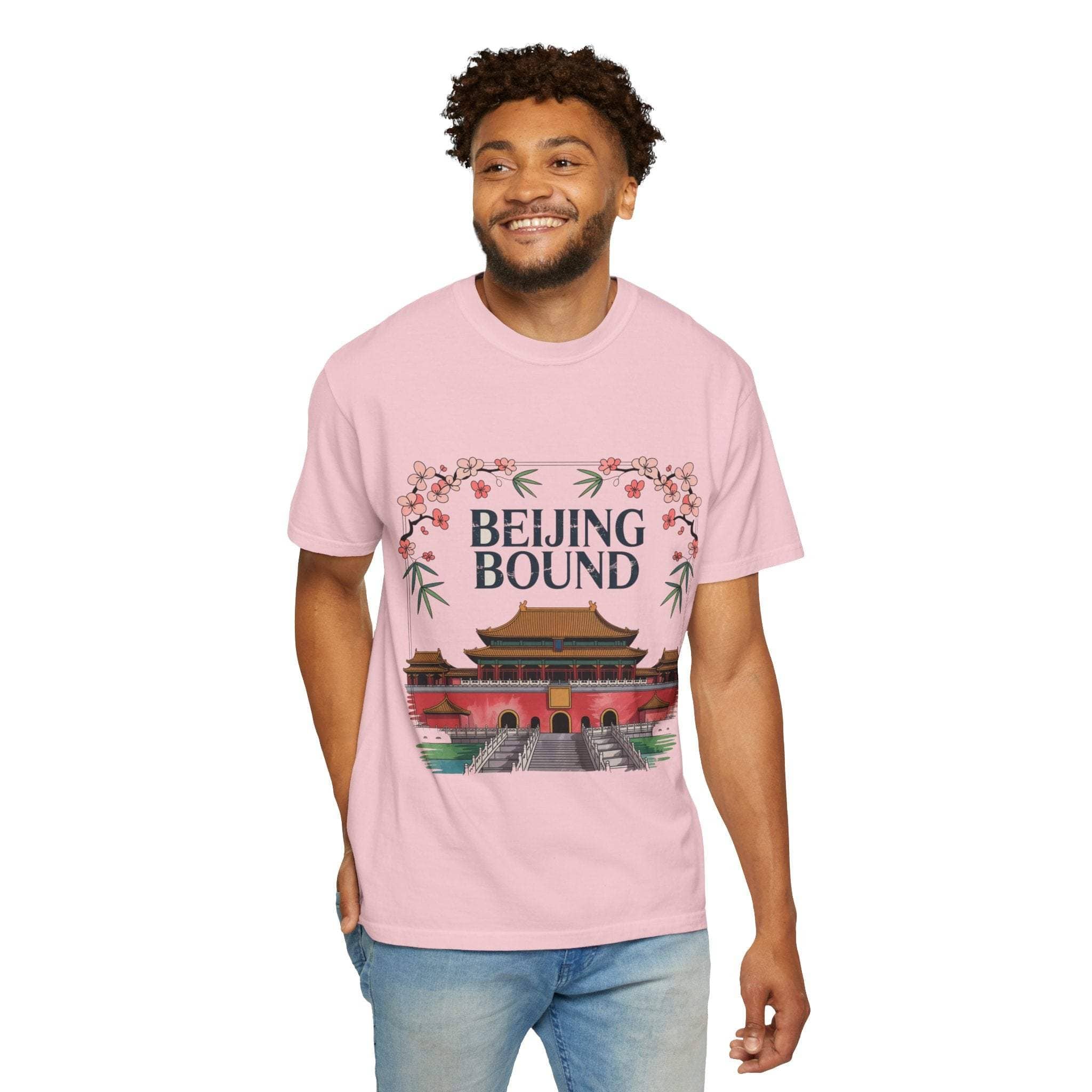 Man wearing pink travel t-shirt with Beijing Bound design and floral accents