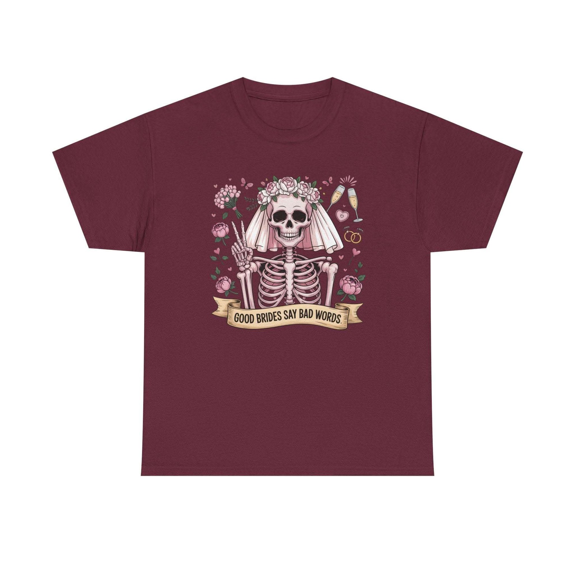 Bride Skull Illustration Tee with smiling skeleton bride, roses, champagne flutes, and "Good brides say bad words" banner on white cotton shirt