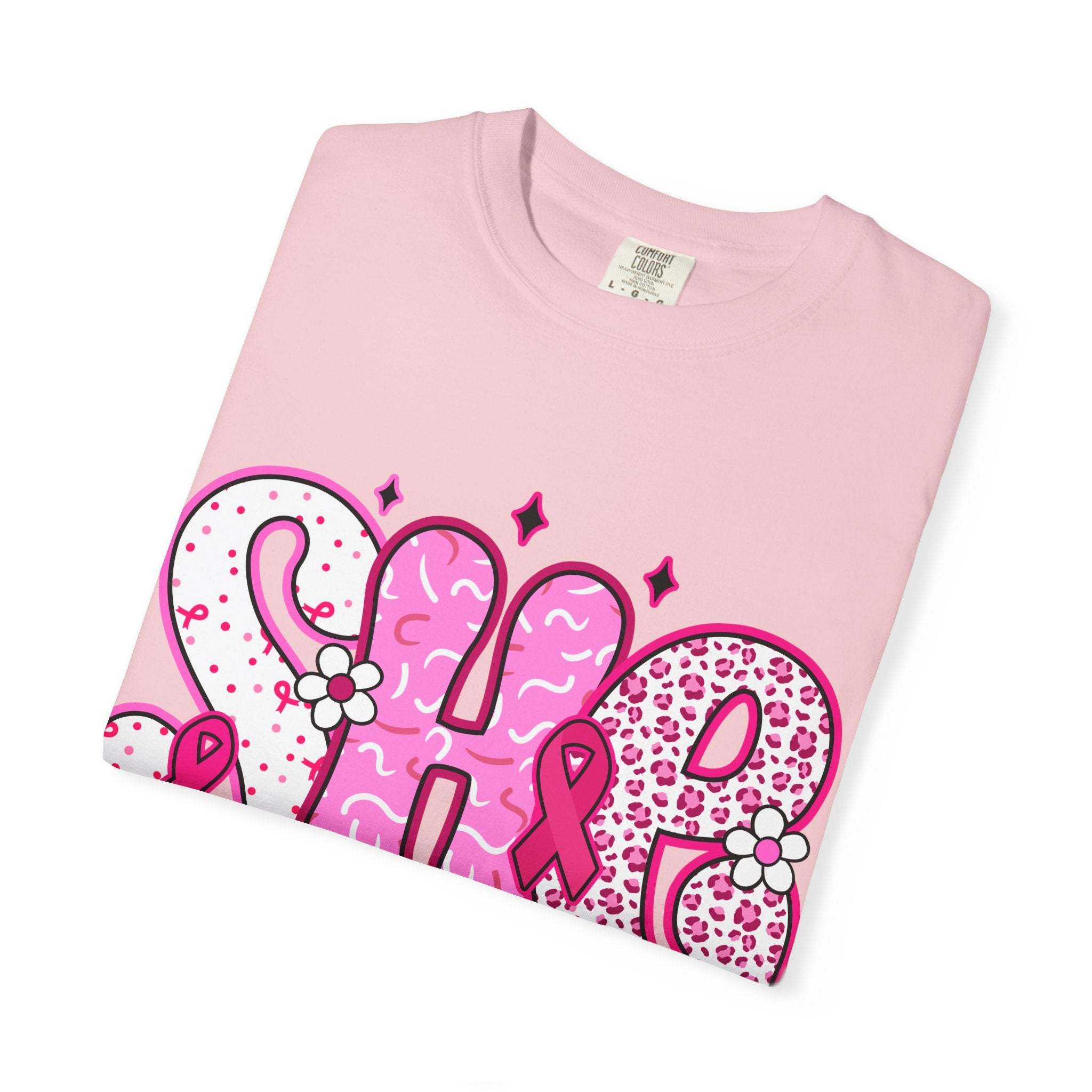 Folded pink Fighter Breast Cancer T-shirt with bold patterned text and ribbon graphics on front