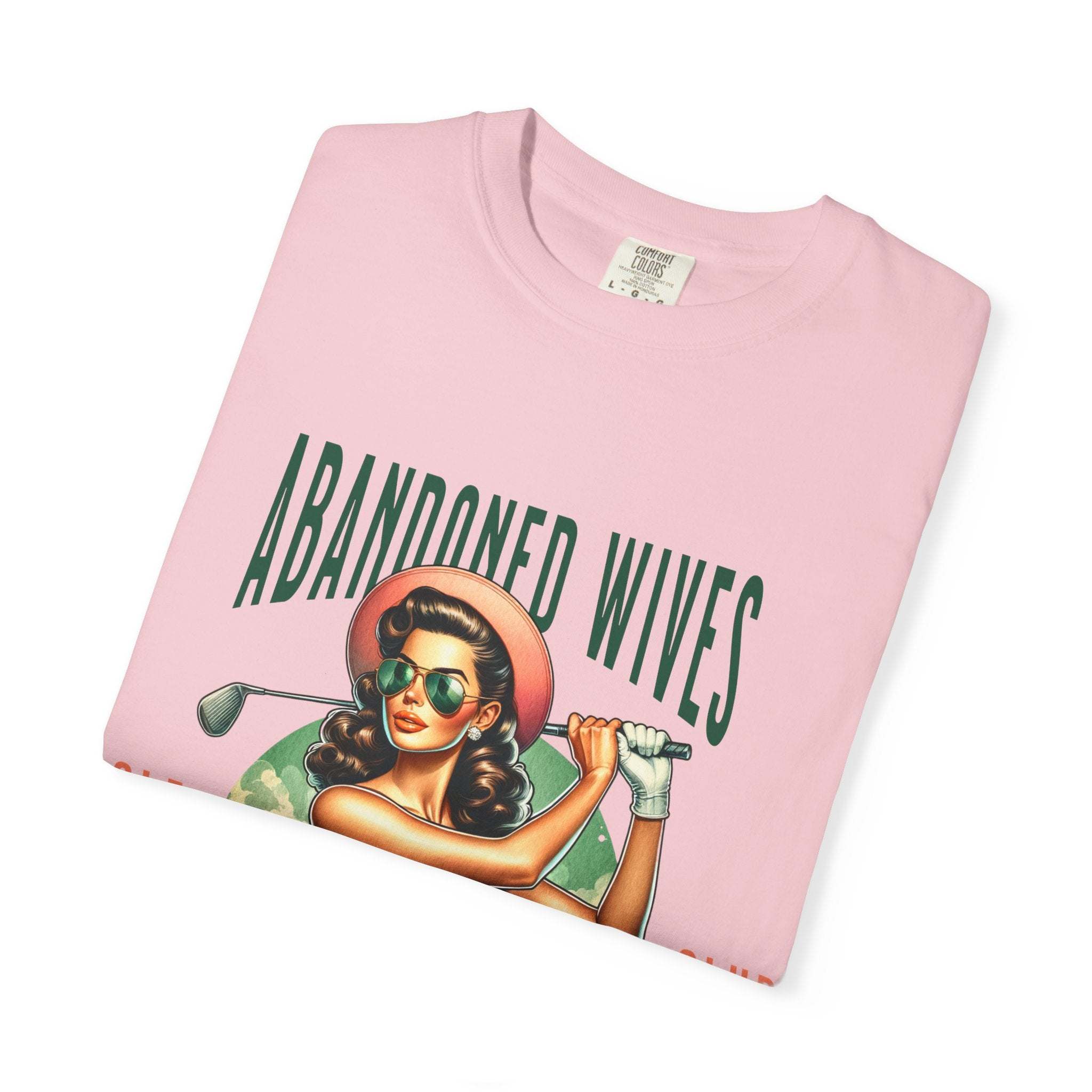 Vintage unisex pink T-shirt with retro Abandoned Wives Golf Club graphic and durable cotton fabric