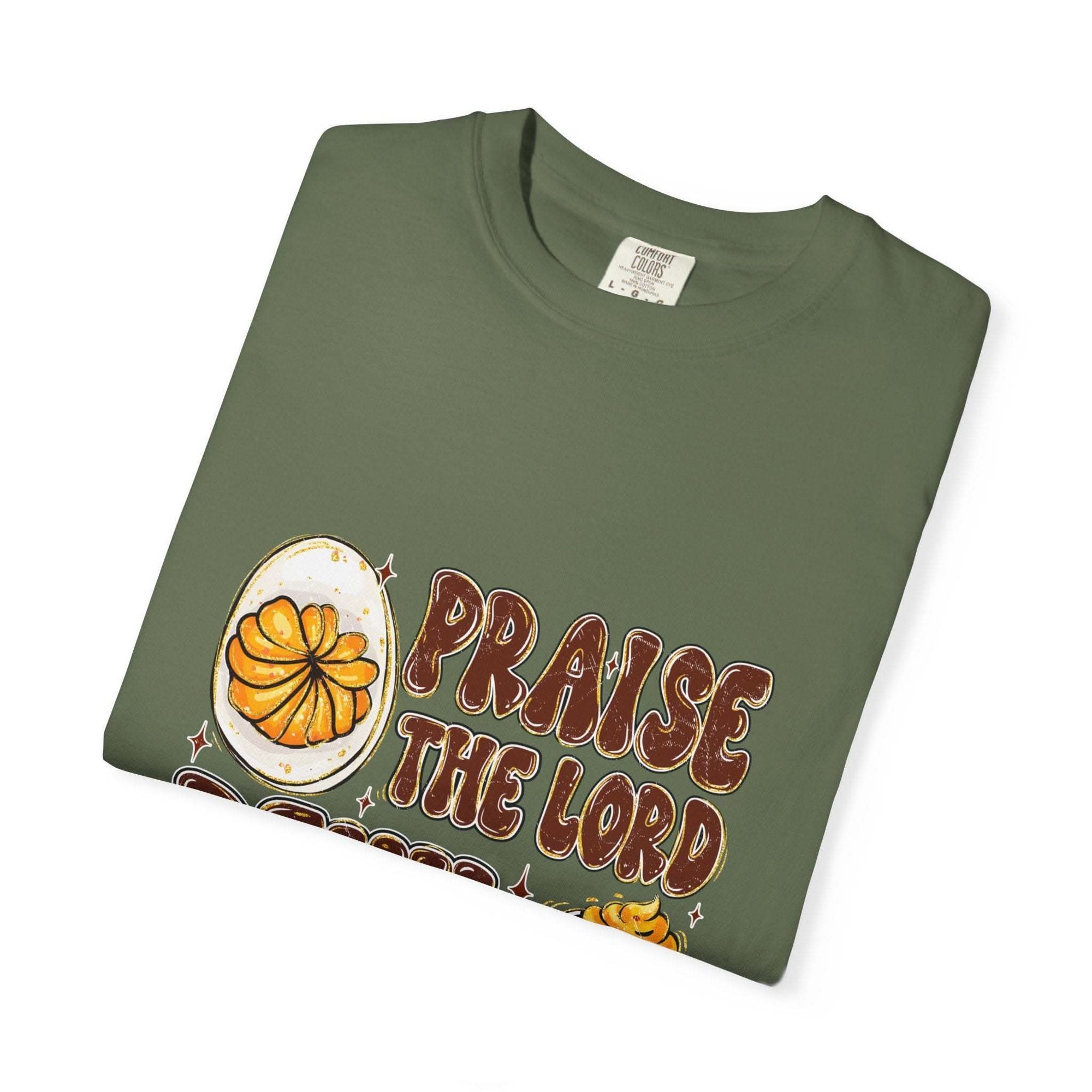 White cotton t-shirt featuring 'Praise the Lord, Devil the Eggs' design, perfect for Easter and Christian apparel.