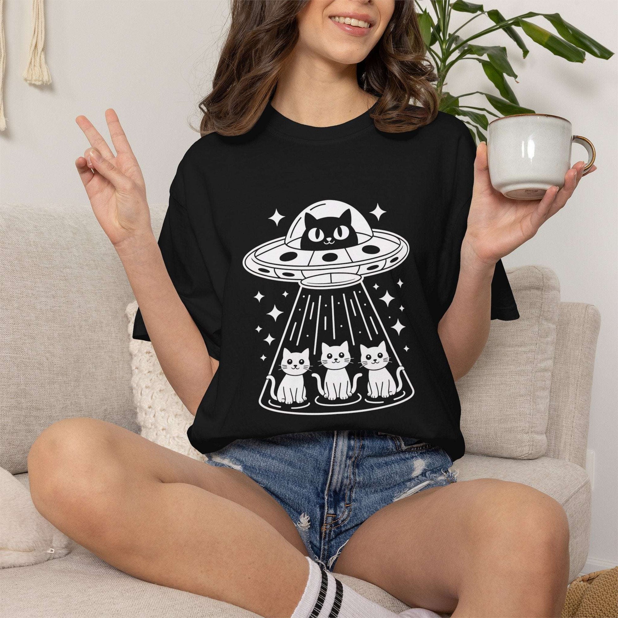 Cat UFO Abduction T-shirt with alien spaceship and funny cat graphic for cat lovers