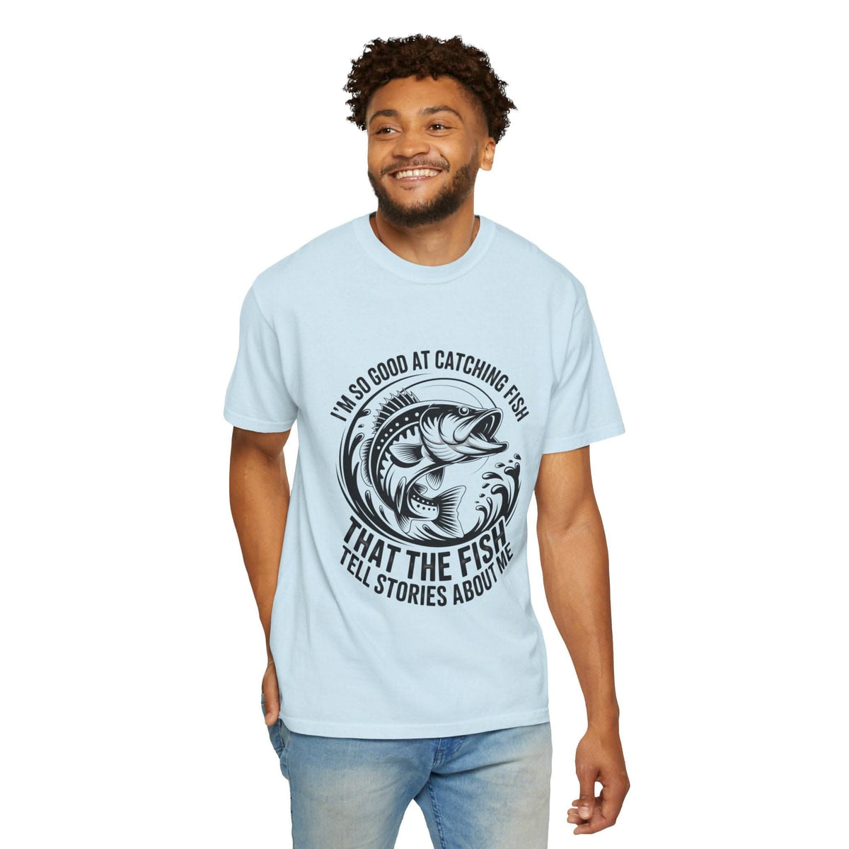 Relaxed fit light blue fishing t-shirt with “So Good At Catching Fish That The Fish Tell Stories About Me” text and fish graphic