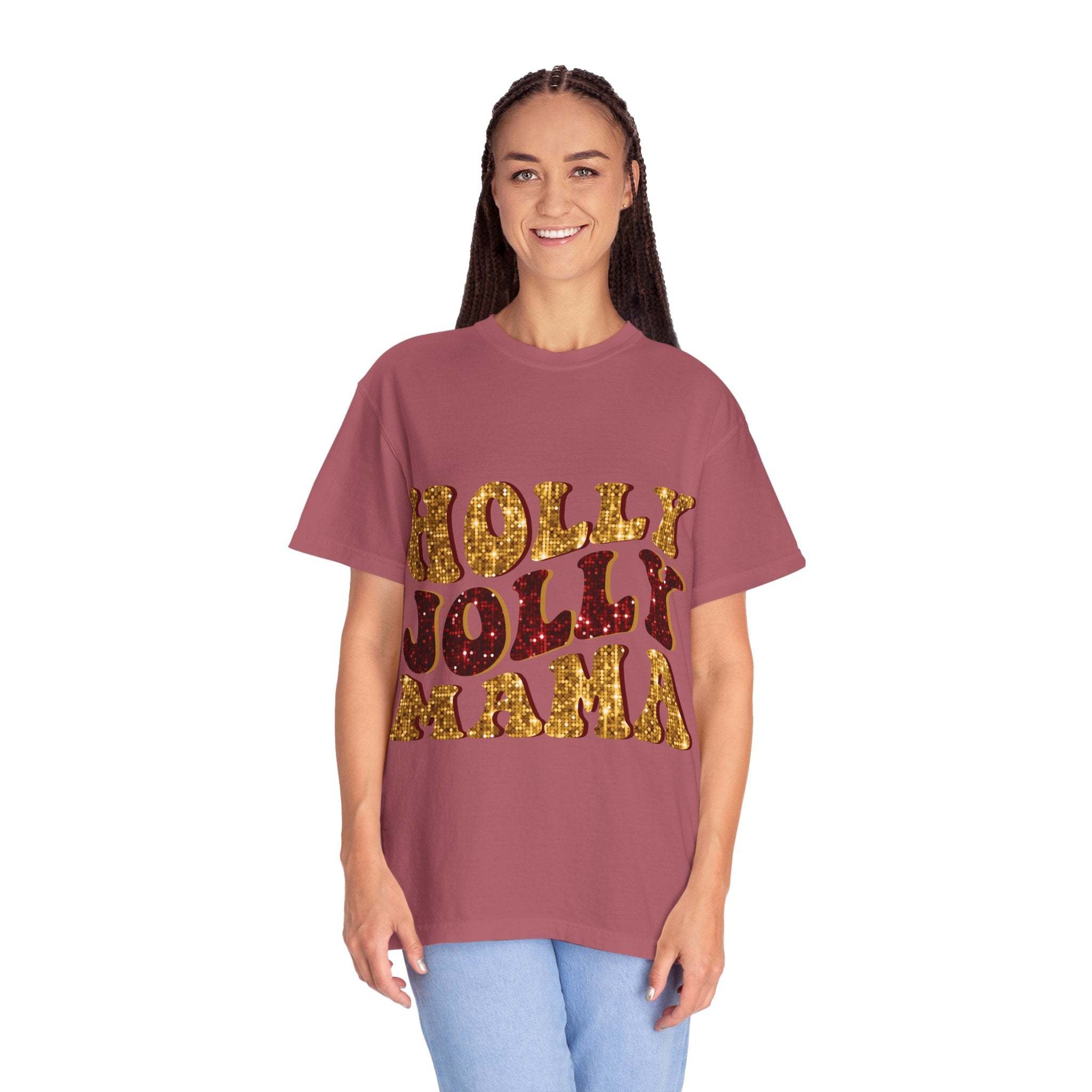 woman wearing mauve Faux Glitter Holly Jolly Mama t-shirt with gold and red glitter text