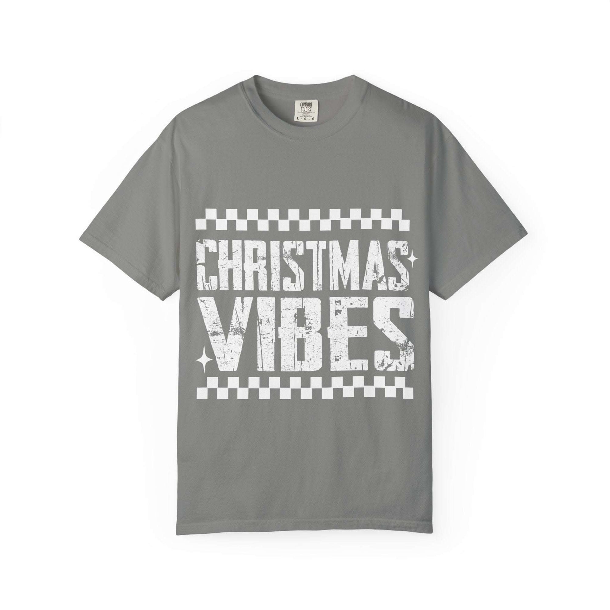 Vintage distressed Christmas vibes t-shirt in soft, faded holiday colors with worn-in charm