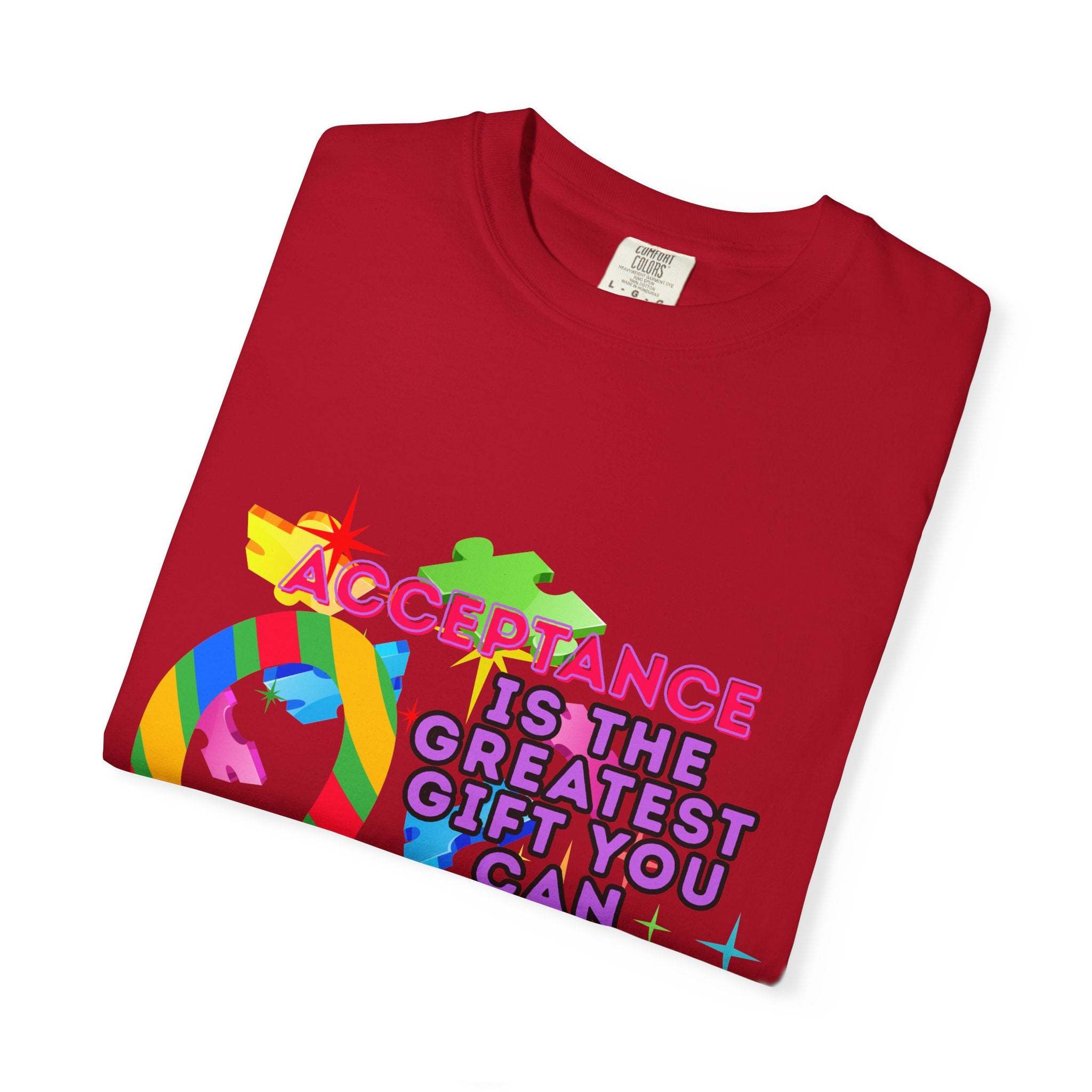 Red garment-dyed T-shirt with colorful Autism Acceptance design and message promoting inclusivity and awareness
