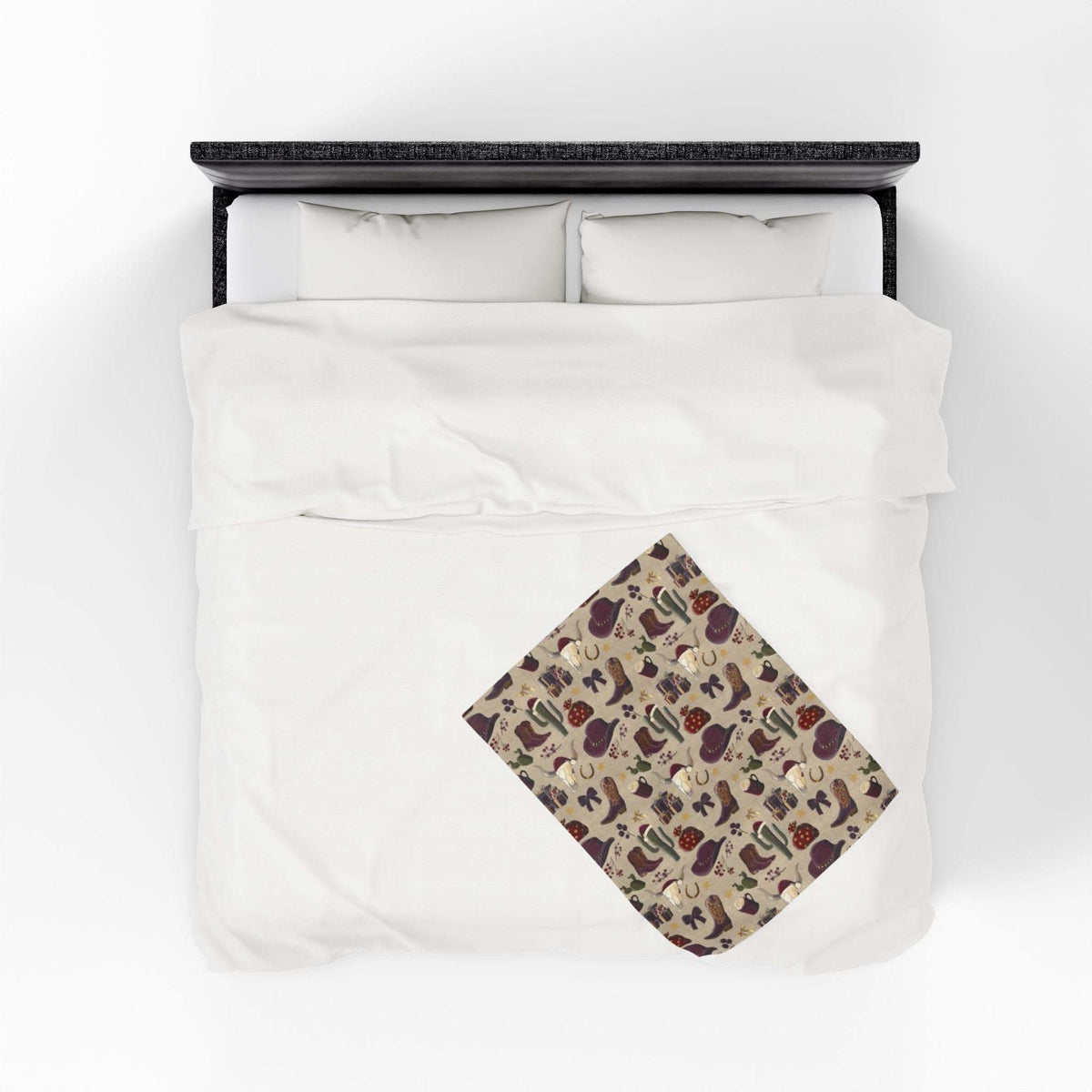 Cozy plush blanket with cowboy Christmas design and vibrant colors on bed